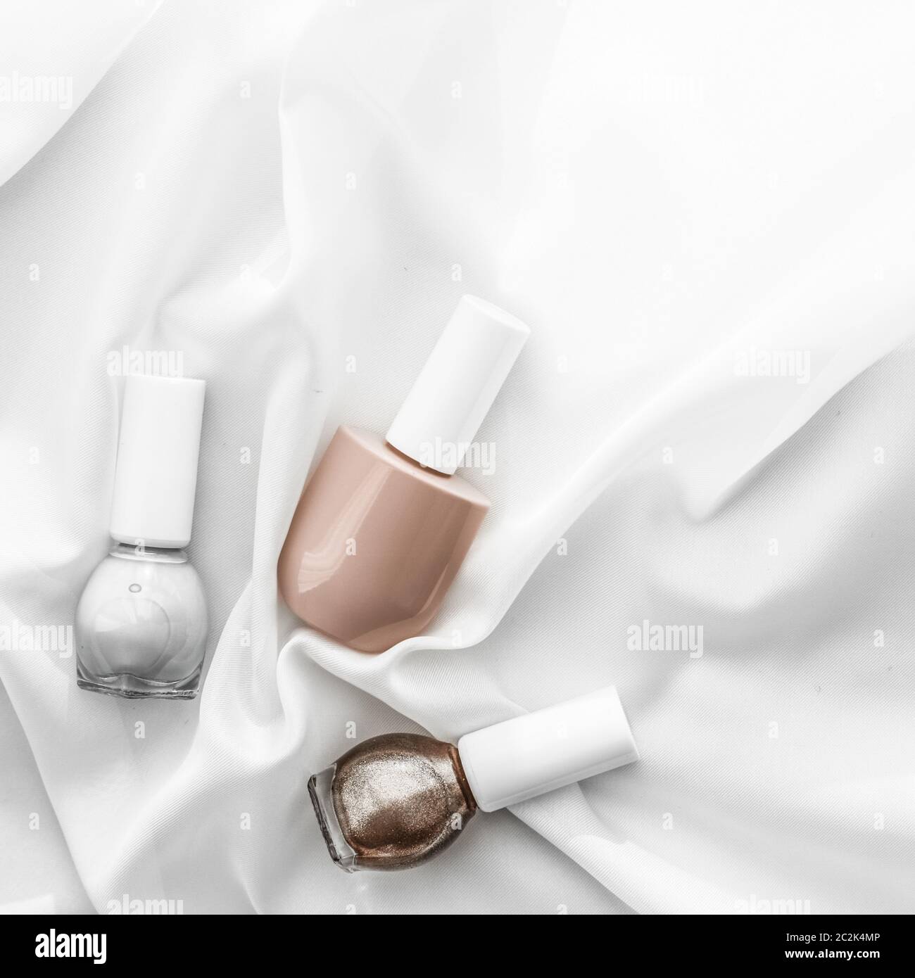 Nail polish bottles on silk background, french manicure products and  nailpolish make-up cosmetics for luxury beauty brand and ho Stock Photo -  Alamy
