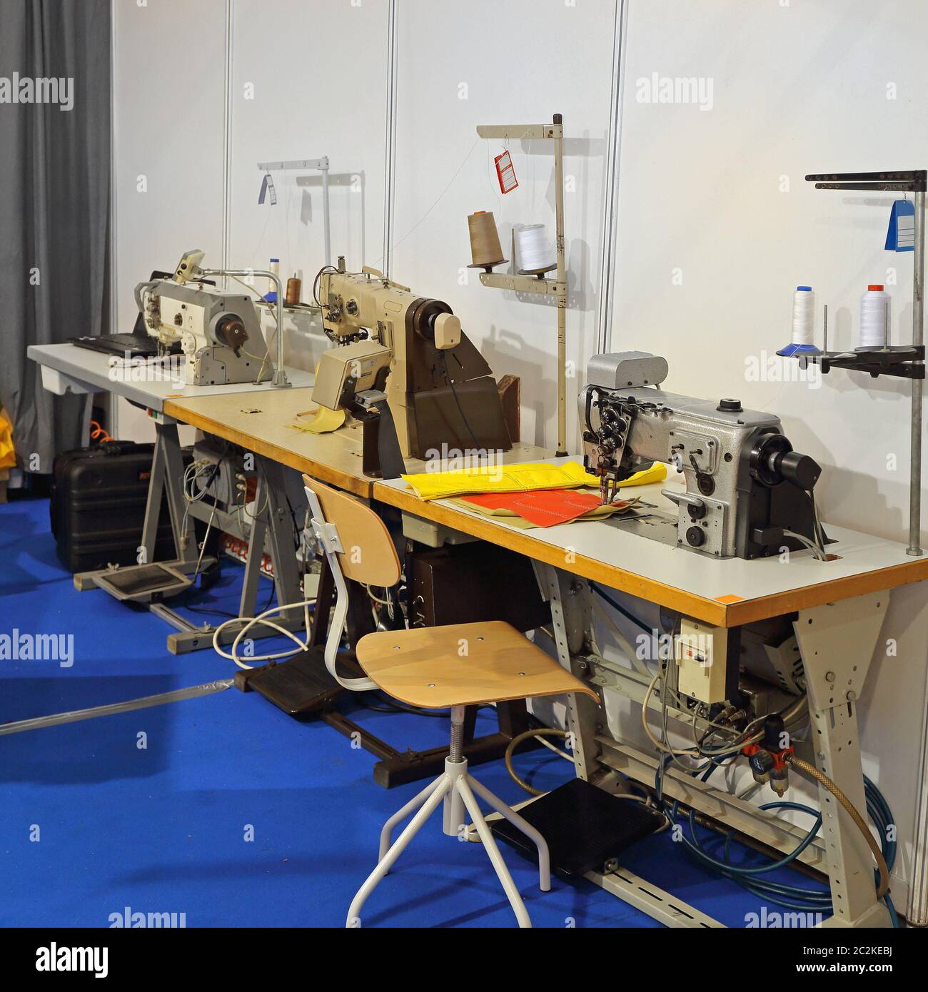 Industrial Sewing Machines in Clothing Production Factory Stock Photo