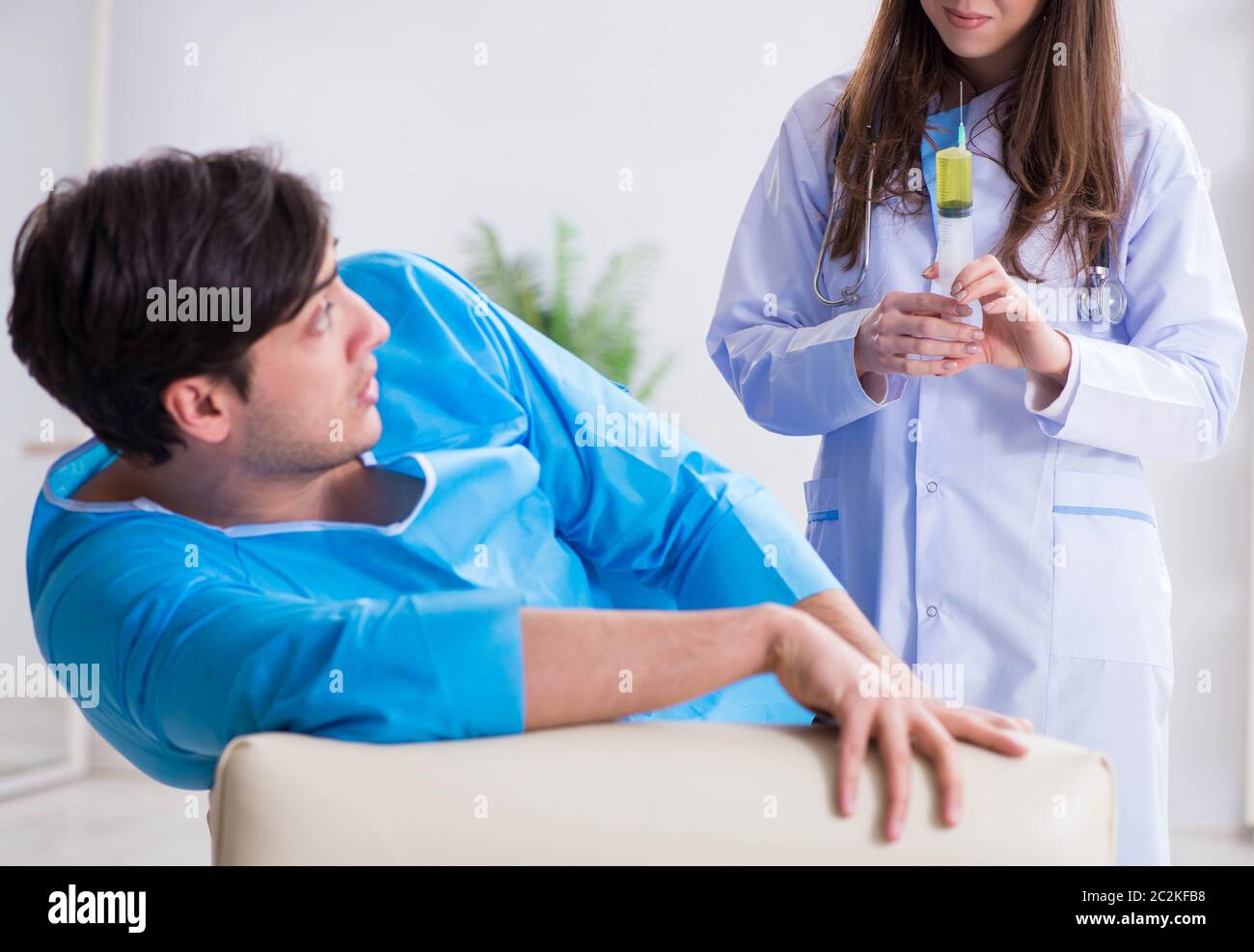 The funny man getting ready for buttocks syringe shot Stock Photo - Alamy