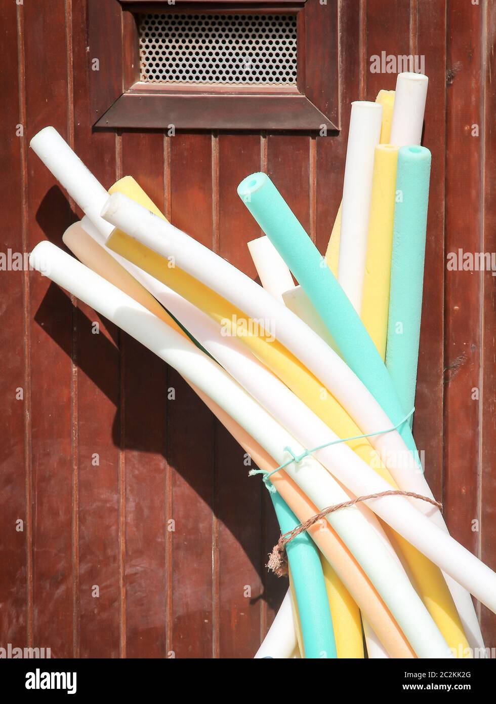 Swimming noodles, swimming noodles are swimming aids and also serve the bathing fun Stock Photo