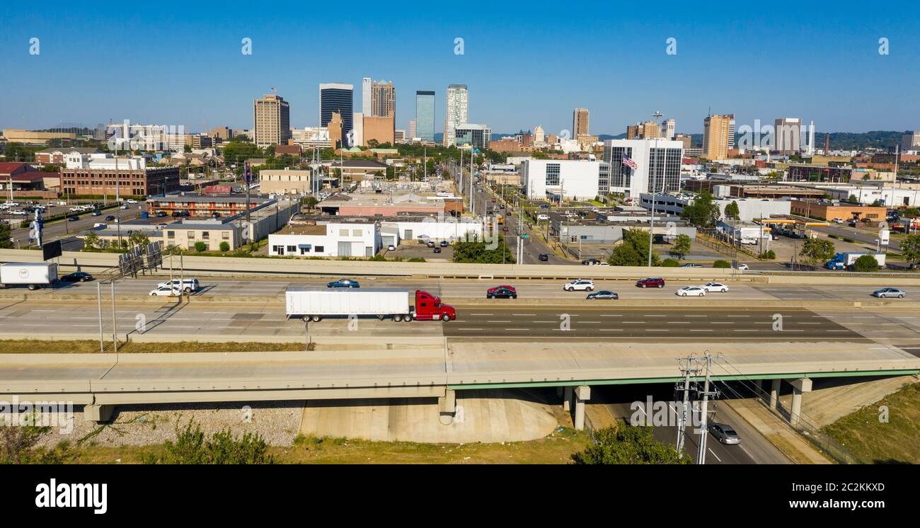 Cars and trucks traverse the urban jungle and maze of highway around downtown Birmingham Alabama Stock Photo