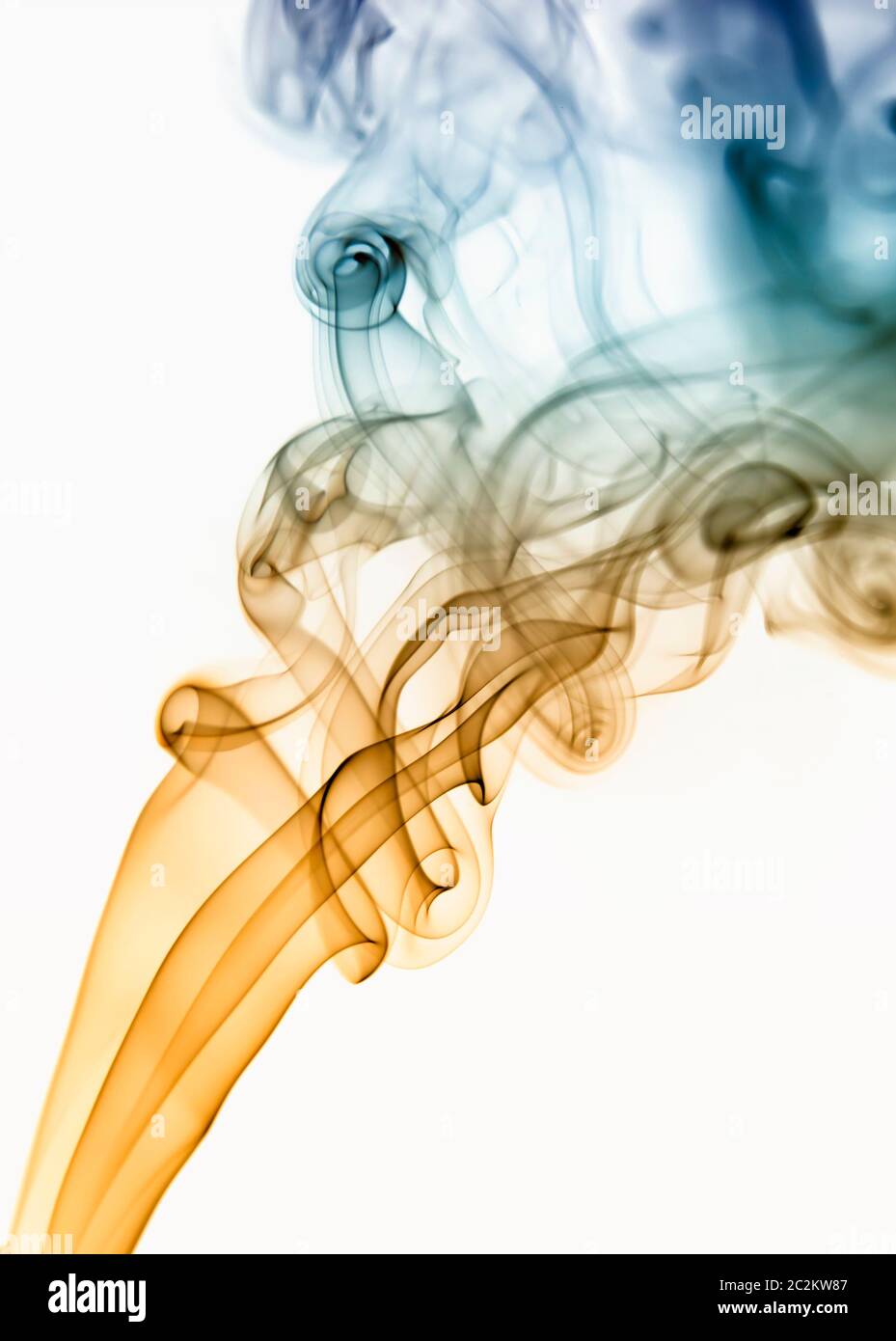 colored smoke from a cigarrette in white background Stock Photo