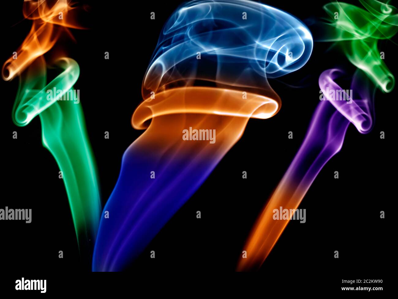 abstract colored smoke in a black background Stock Photo - Alamy