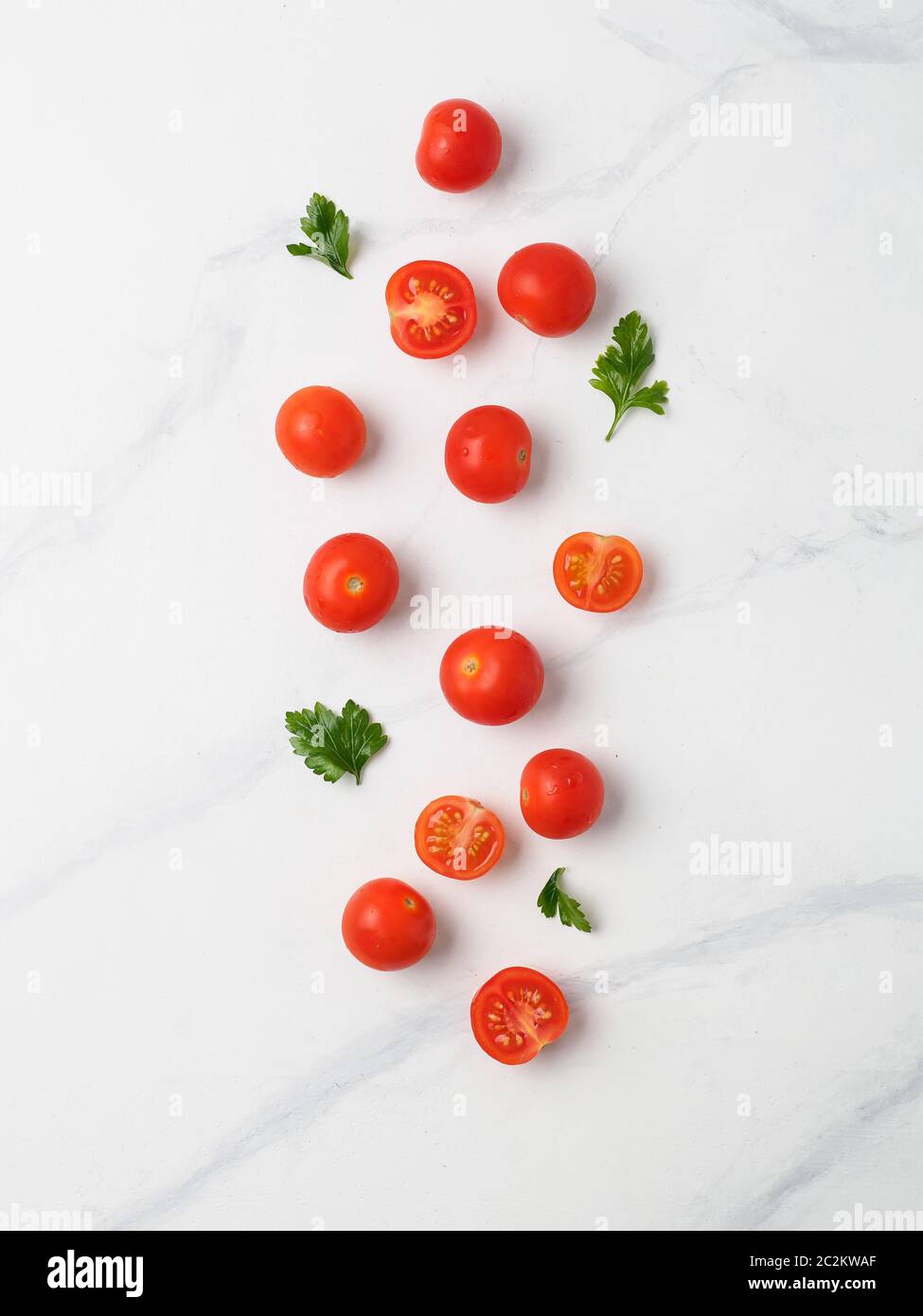 Cherry tomatoes on white marble table Stock Photo
