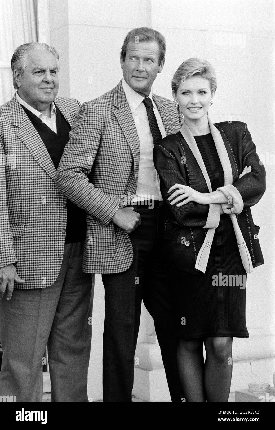 DEAUVILLE, FRANCE. Sept 1985: Actors Roger Moore & Fiona Fullerton & producer Albert R. Broccoli promoting their movie 'A View to a Kill' at the Deauville Film Festival. © Paul Smith/Featureflash Stock Photo