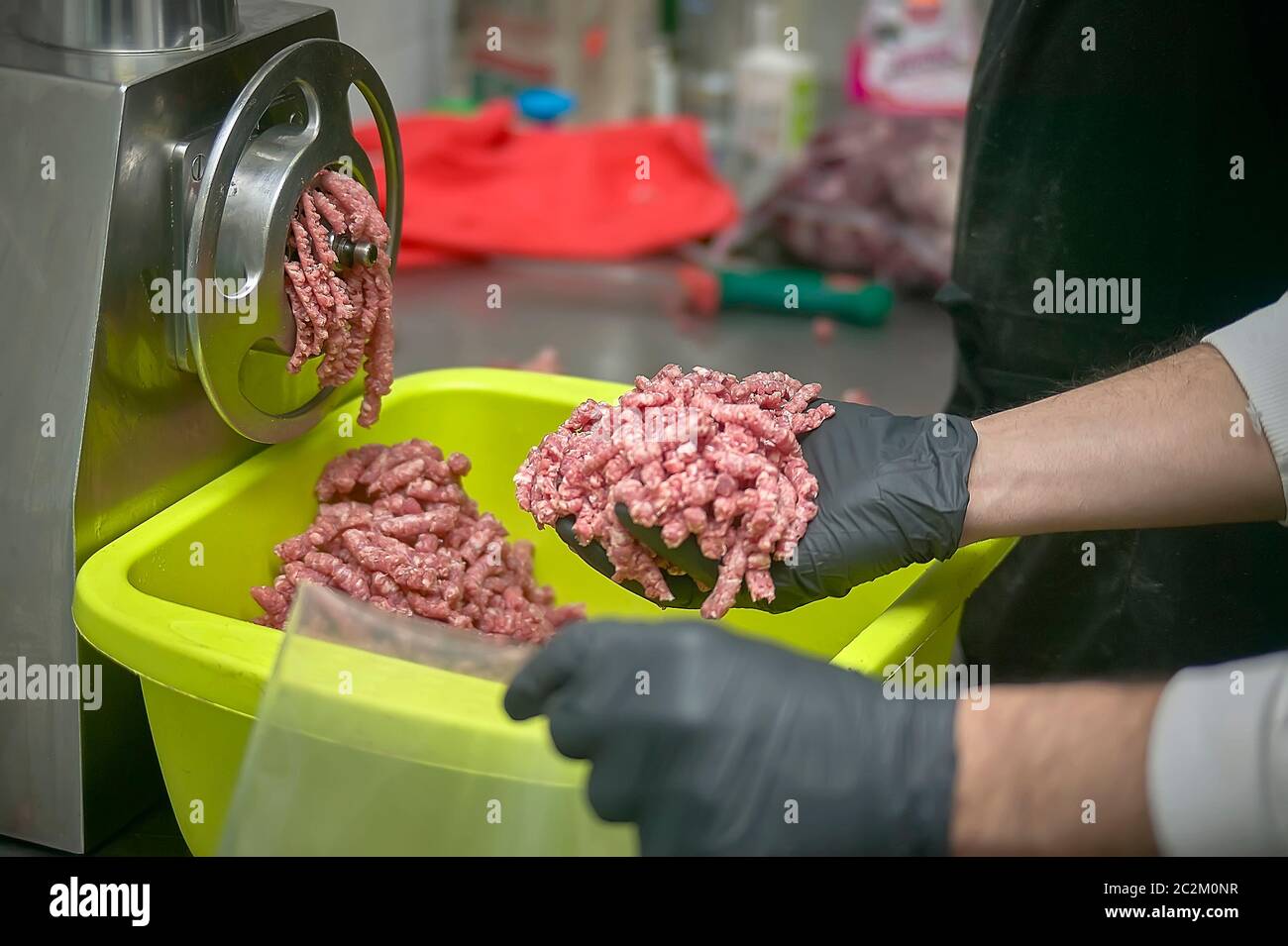 Detail of the grinding spike extruder still dirty and full of the meat it  has just ground Stock Photo - Alamy