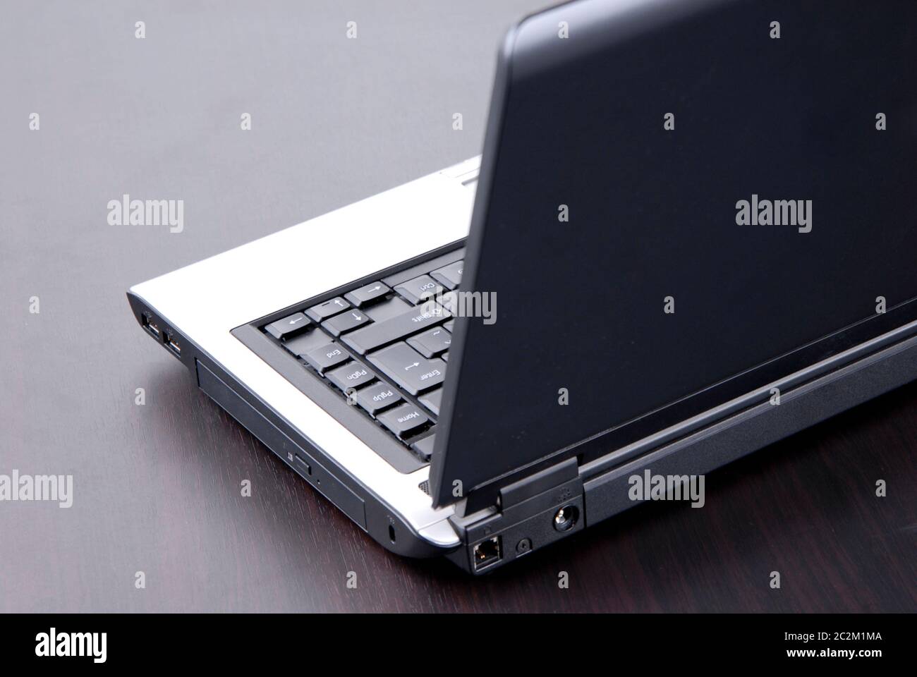 laptop keyboard detail in a black table Stock Photo - Alamy