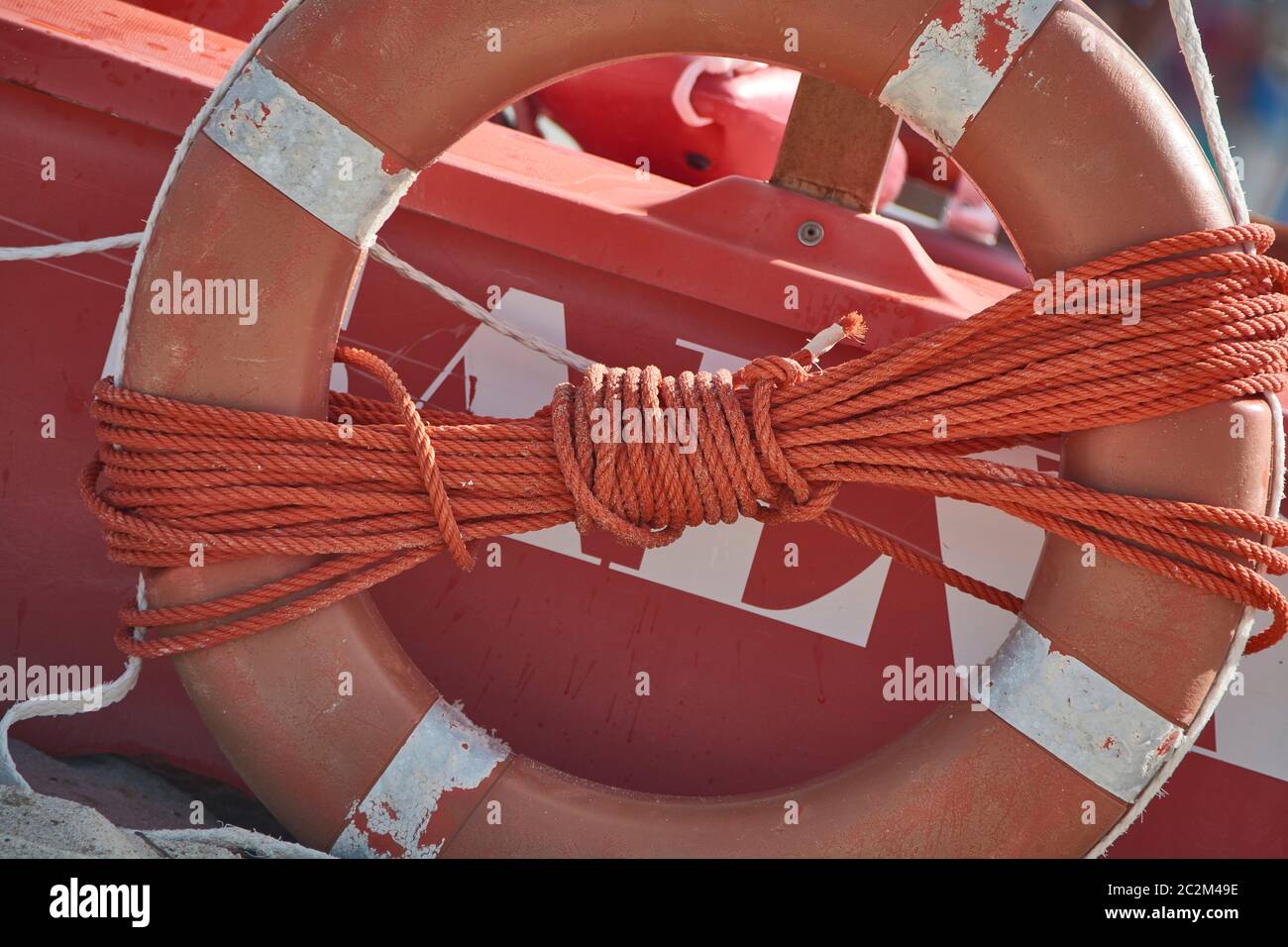 Life Jacket Rope Still life including a plastic life jacket with a rope tied around it ...