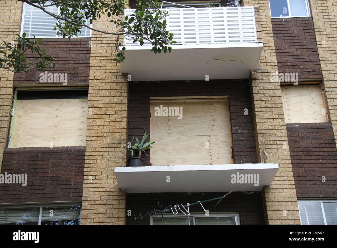 Three rooms have had their windows boarded up at the apartment on Bridge Road, Glebe in Sydney’s inner-west after they were destroyed in an explosion. Stock Photo