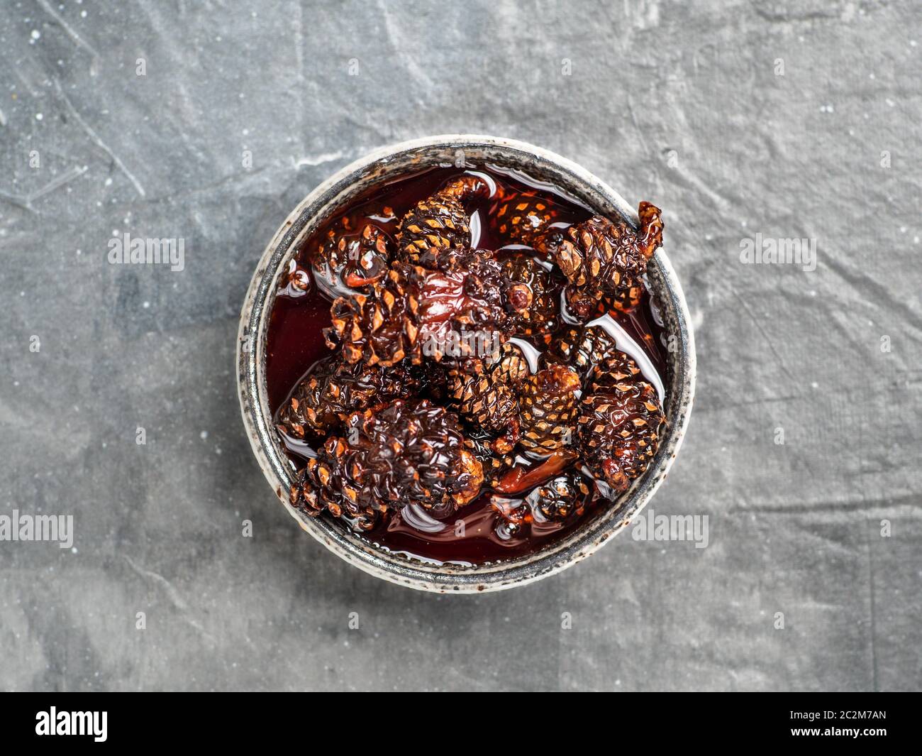 Jam with baby pine cones Stock Photo