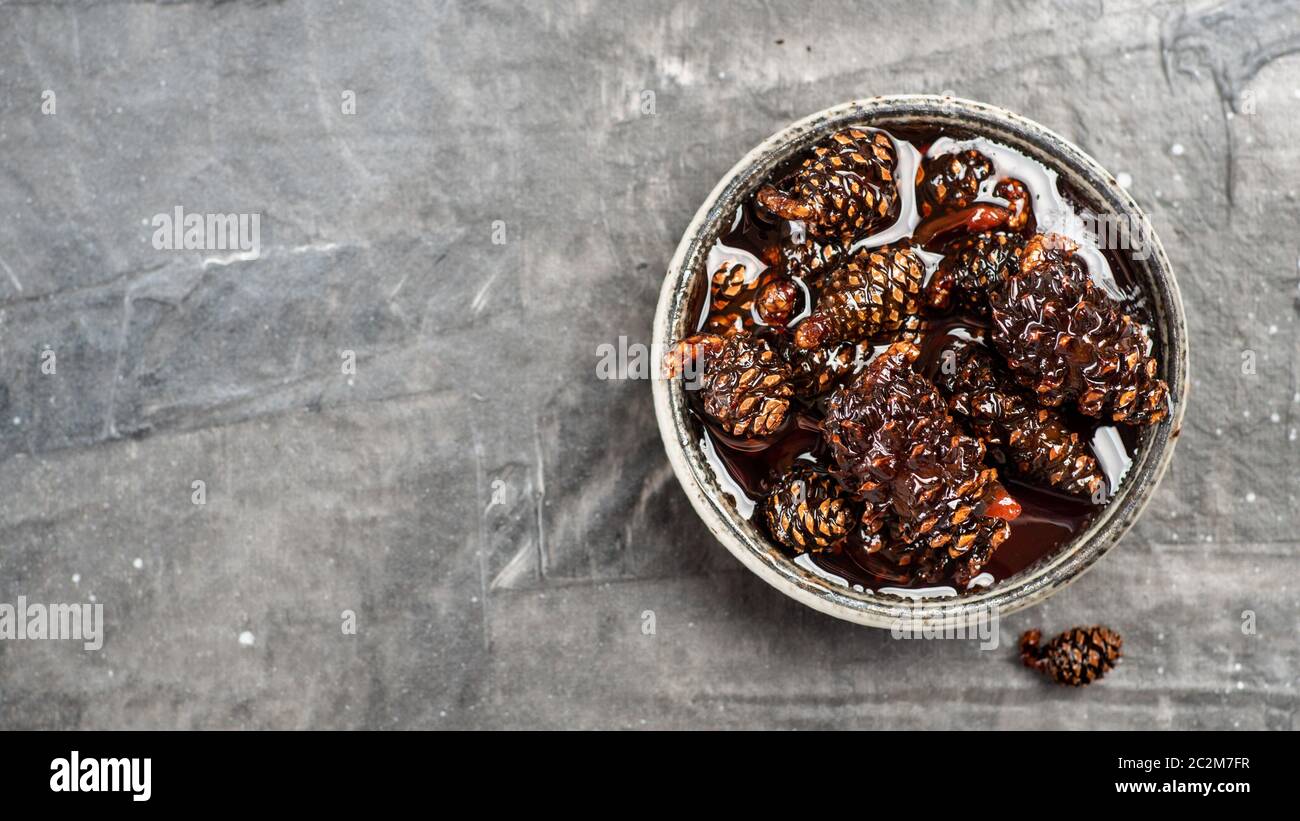 Jam with baby pine cones Stock Photo