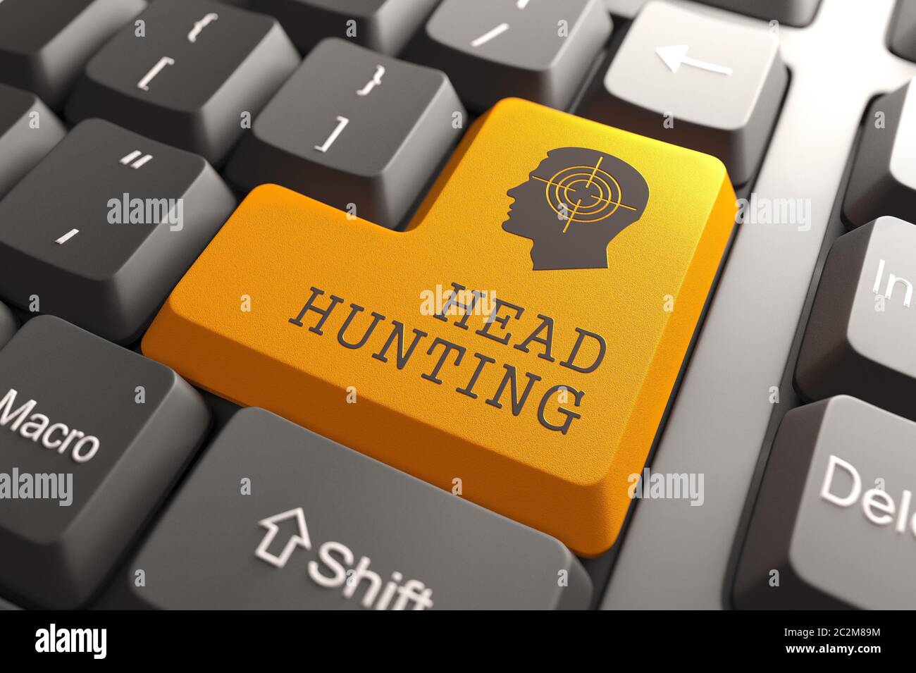 Orange Headhunting Button on Computer Keyboard. Business Concept. Stock Photo