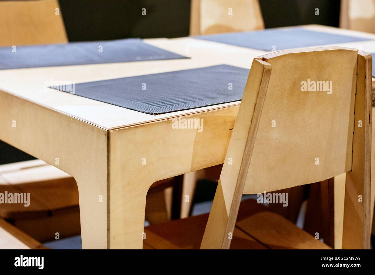 wooden table and chairs in a restaurant. Design furniture Stock Photo