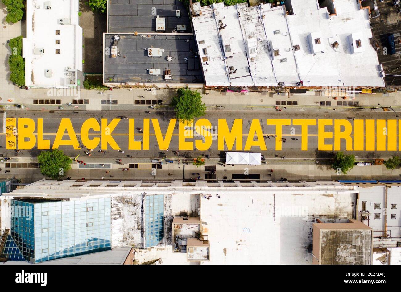 Brooklyn, United States. 17th June, 2020. A giant 'BLACK LIVES MATTER' sign is painted in orange on Fulton Street in New York City in June of 2020. Photo by Creative Jenius Report/The Billie Holiday Theatre/UPI Credit: UPI/Alamy Live News Stock Photo