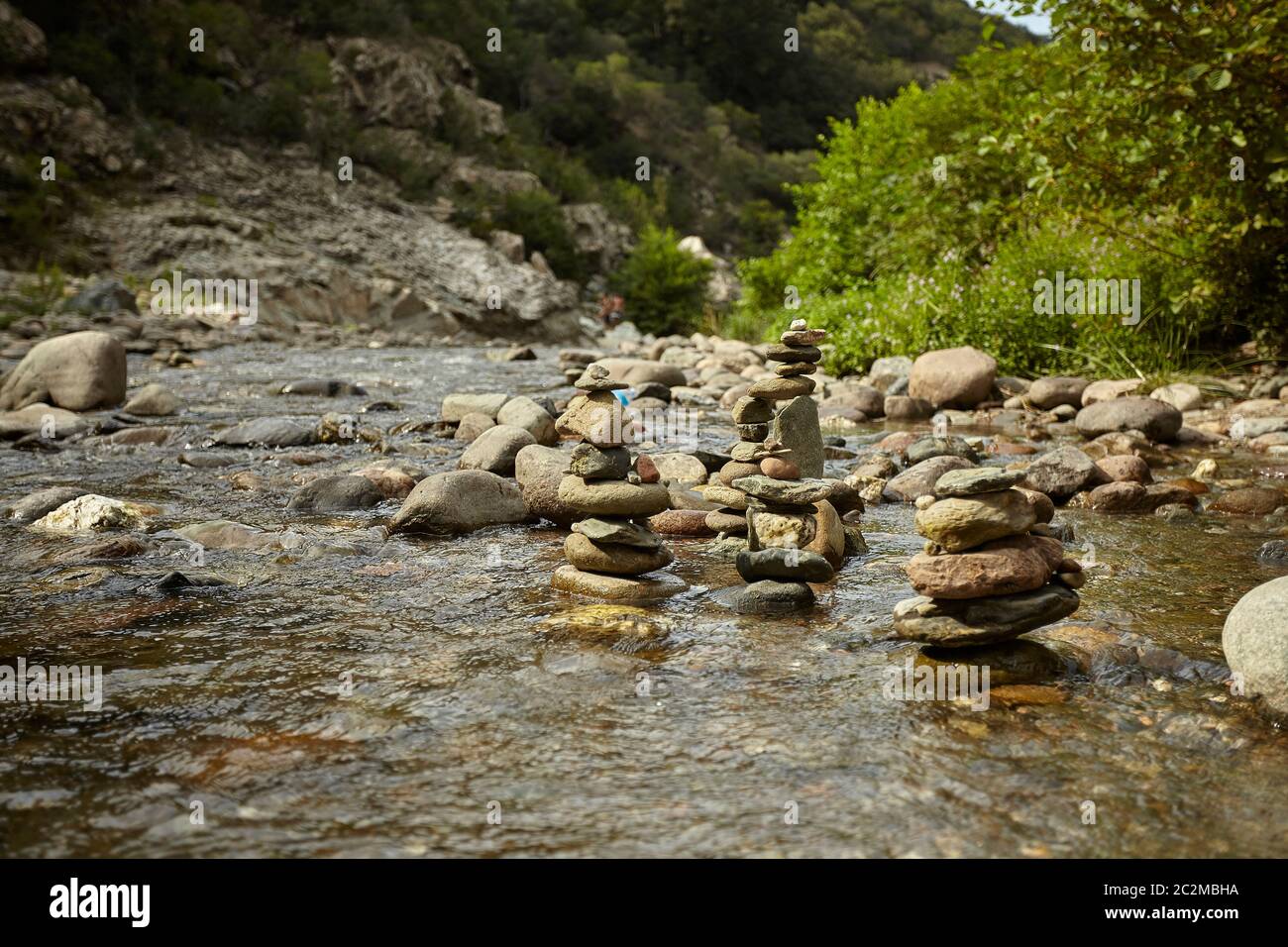 Mountain Rocks Strream Mountain stream with some stacks of rocks in its center put there by ...