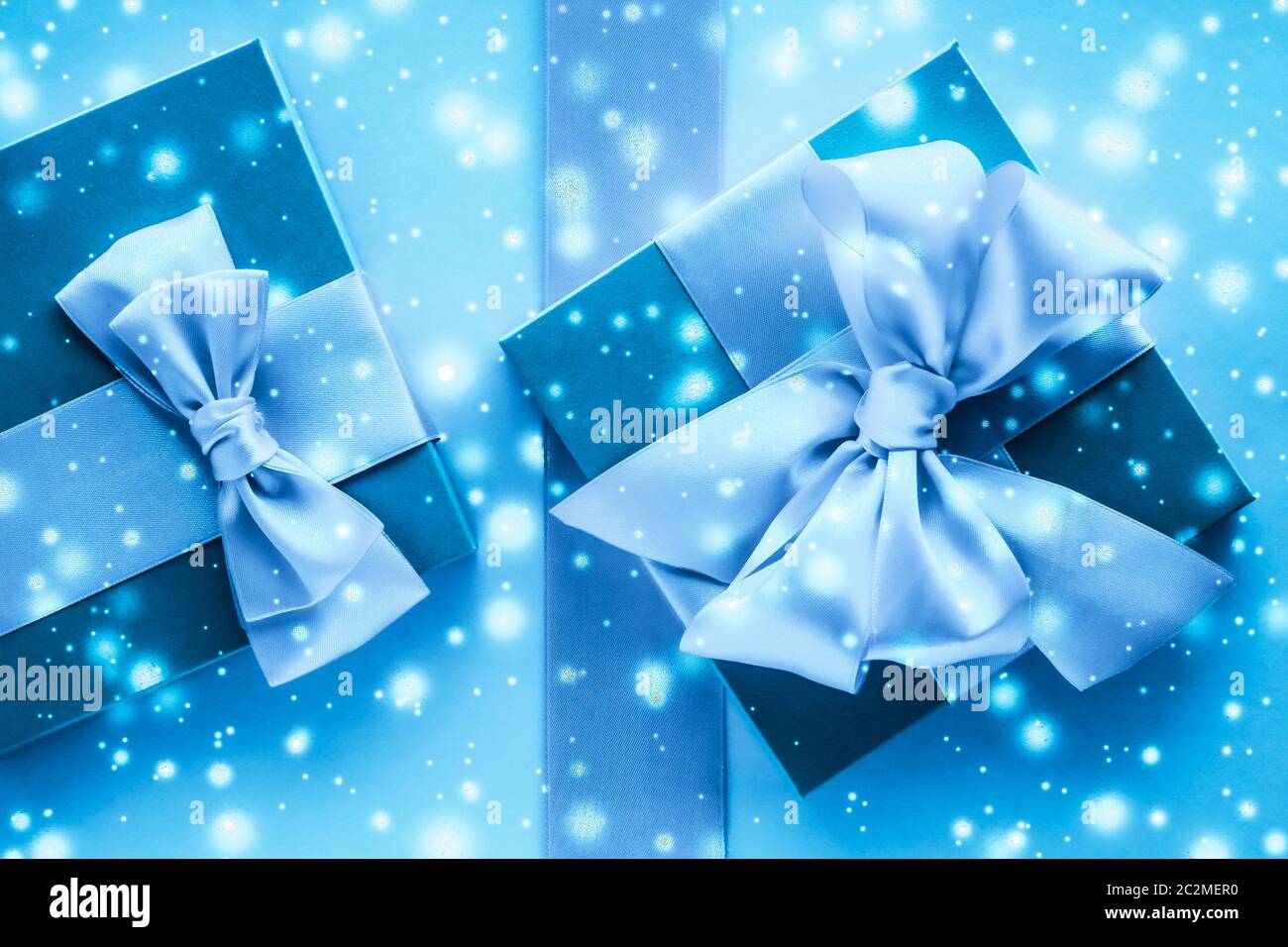 Winter holiday gifts and glowing snow 