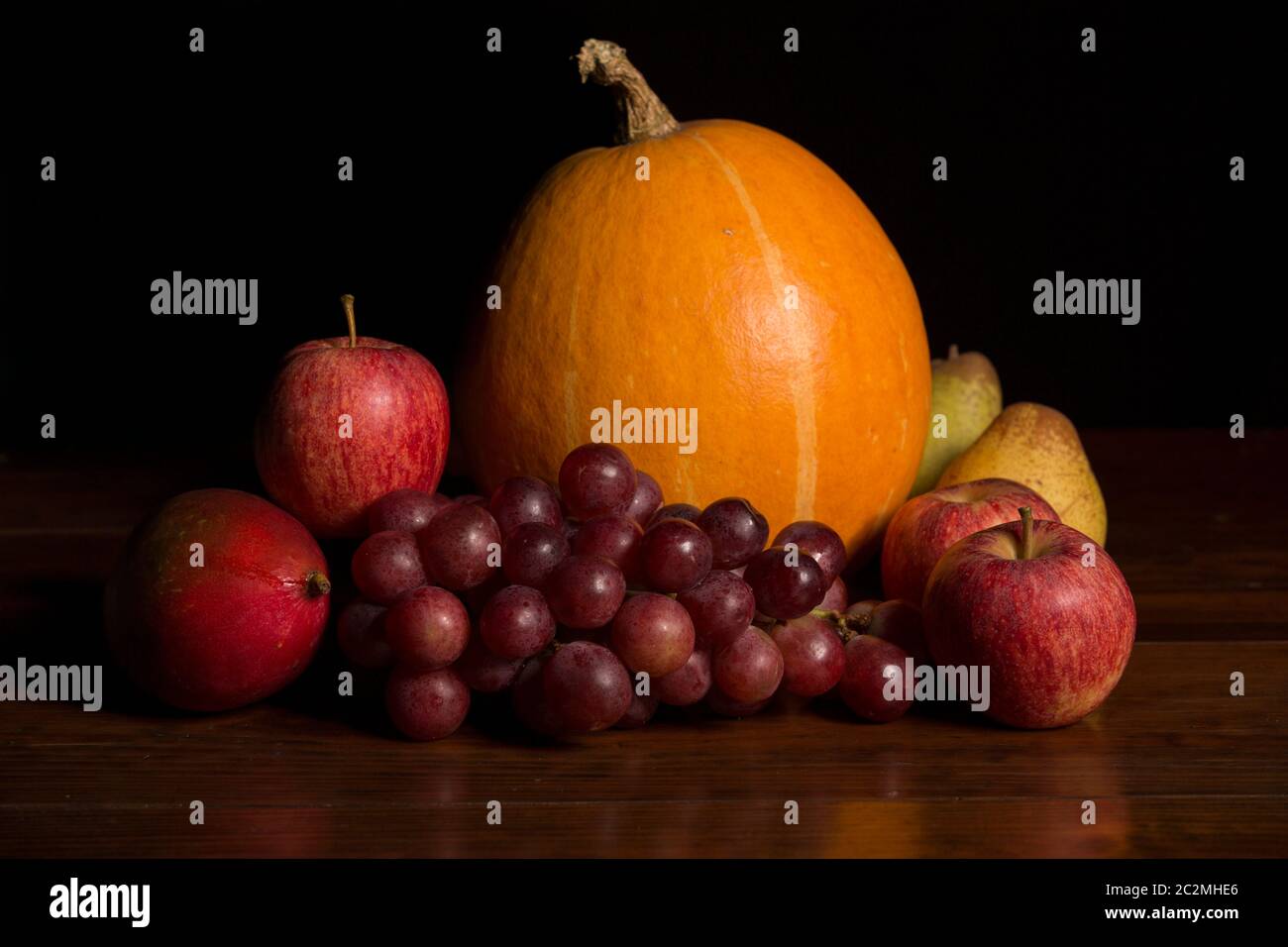 variety of fruits on a wooden table, studio picture Stock Photo - Alamy