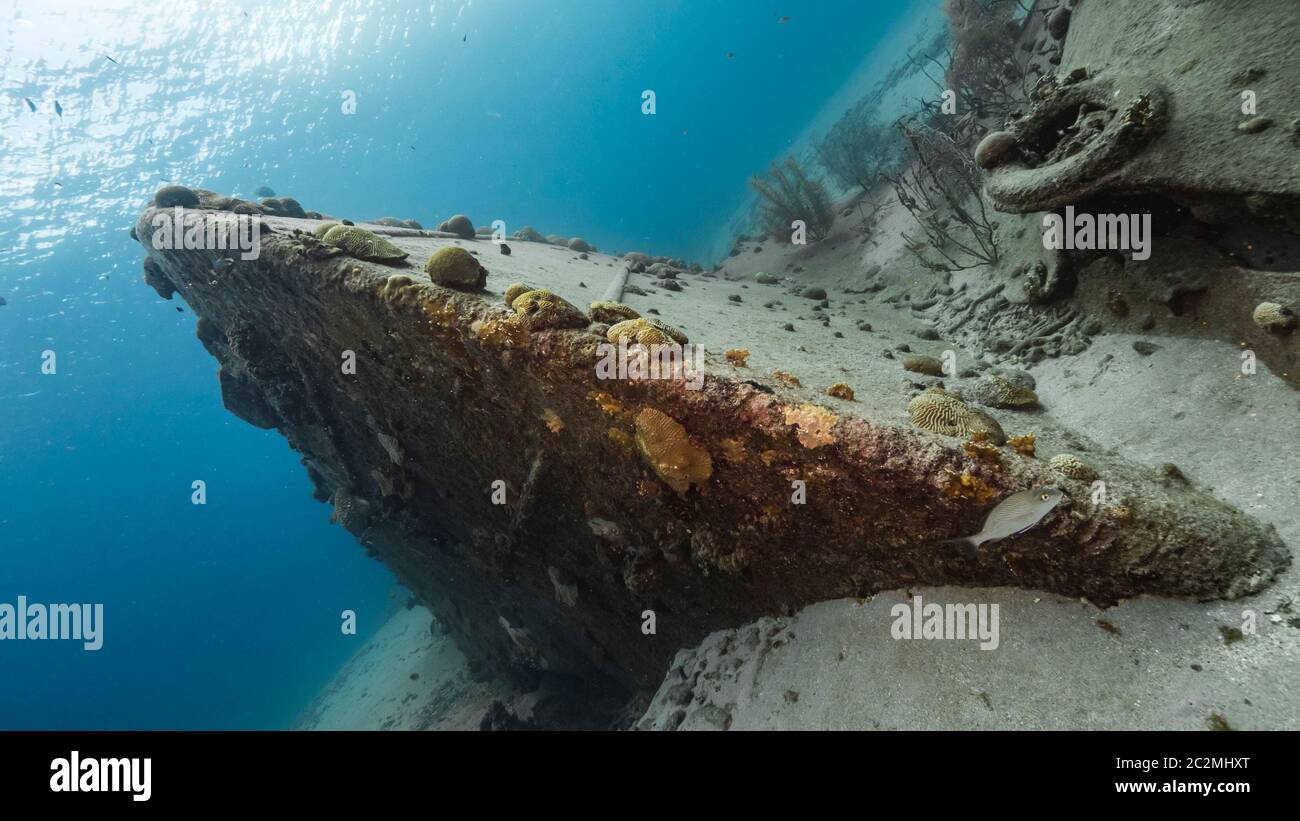 Ship wreck 'Black Sand Wreck' in coral reef of Caribbean sea around Curacao Stock Photo