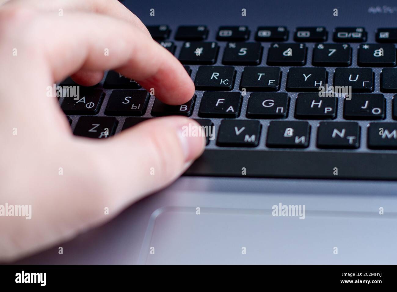 hand typing on laptop keyboard and touchpad Stock Photo Alamy