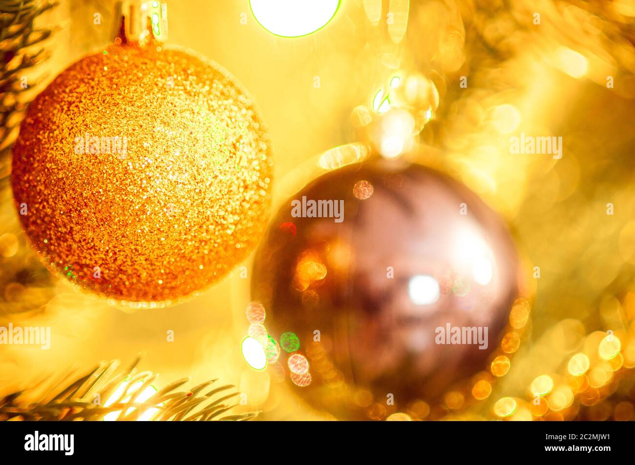 Christmas balls on the tree on the background of bokeh Stock Photo - Alamy