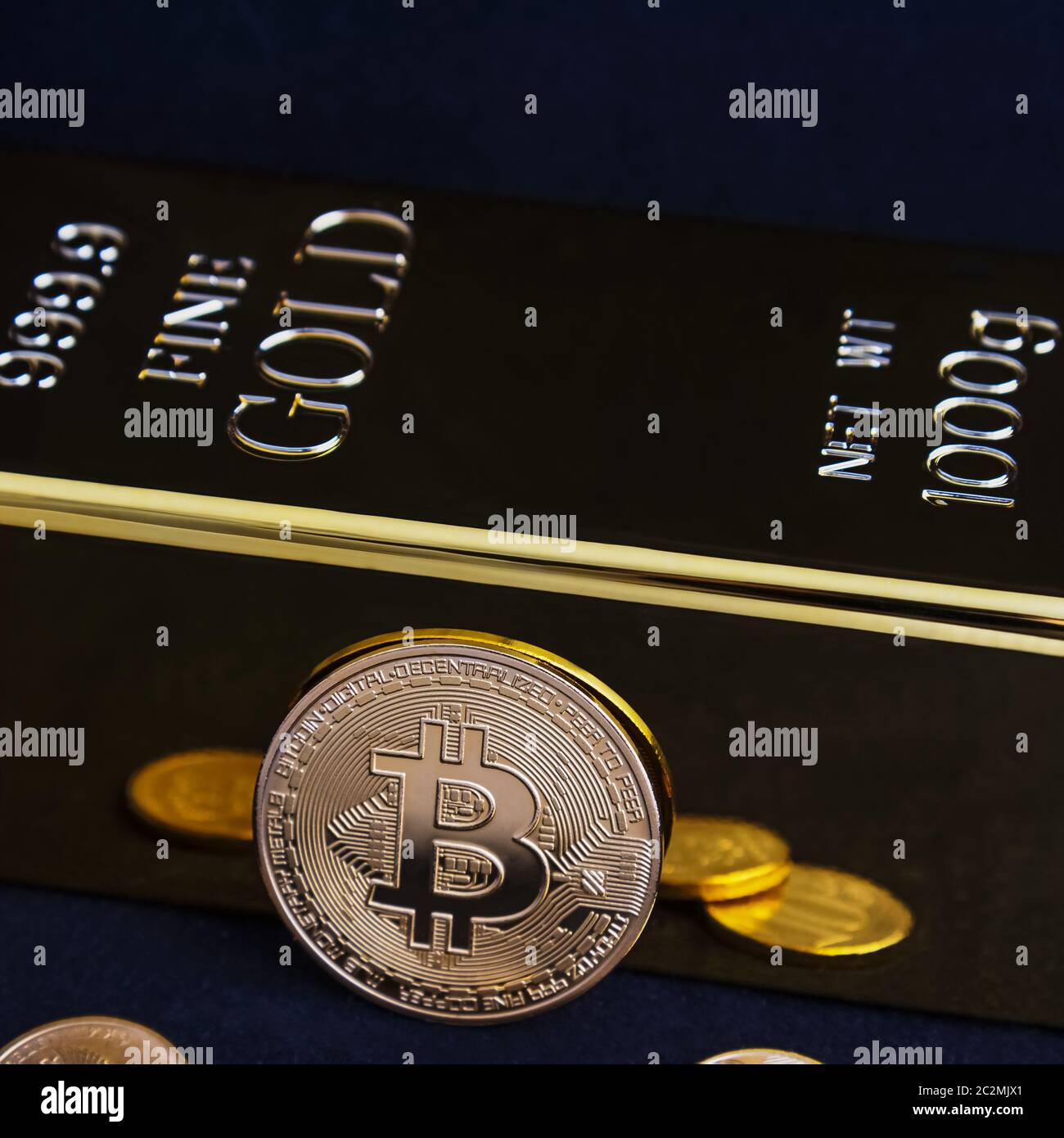 Bitcoin cryptocurrency and gold bar on a black background Stock Photo -  Alamy