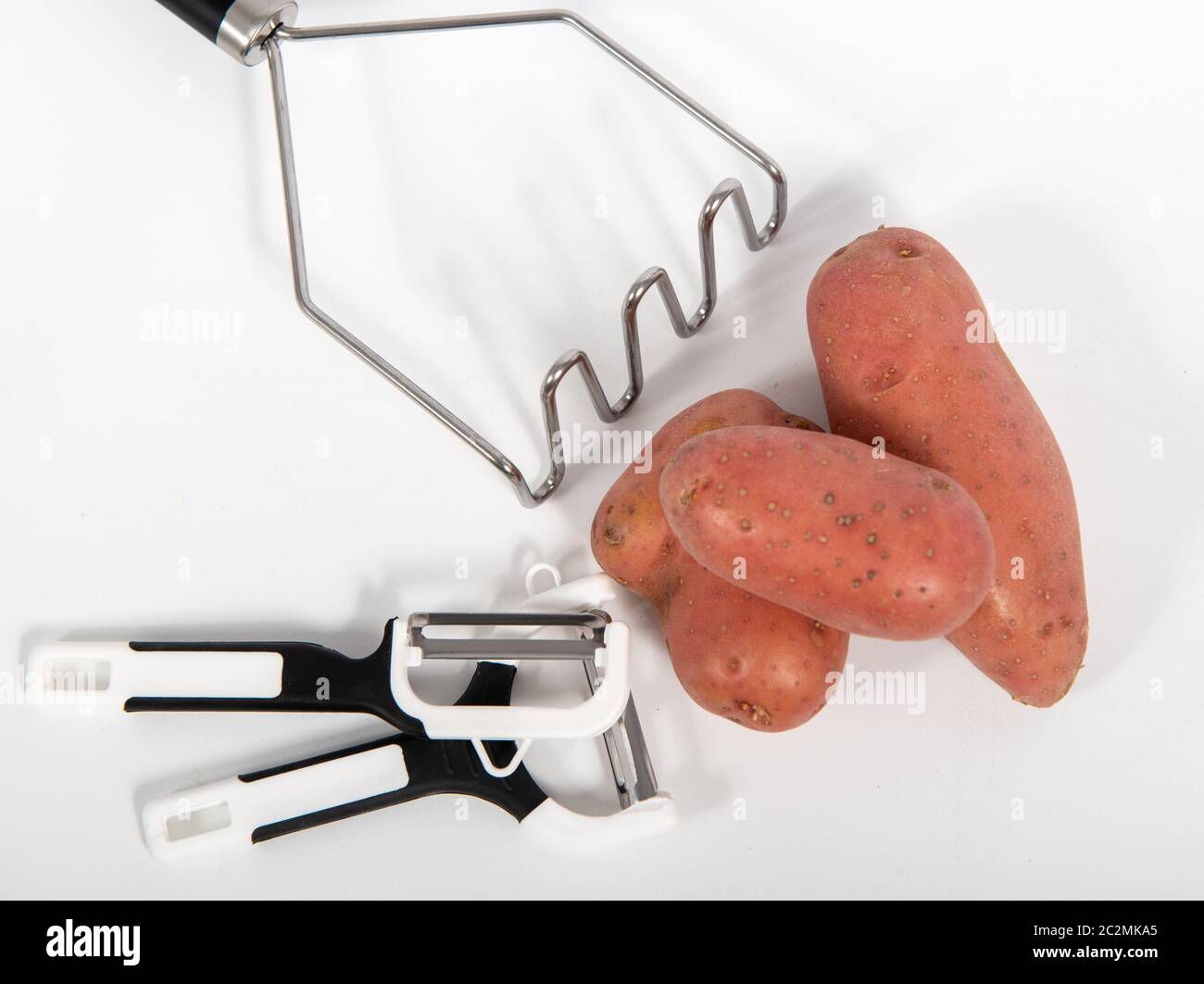 potatoes and mash press isolated on a white background Stock Photo