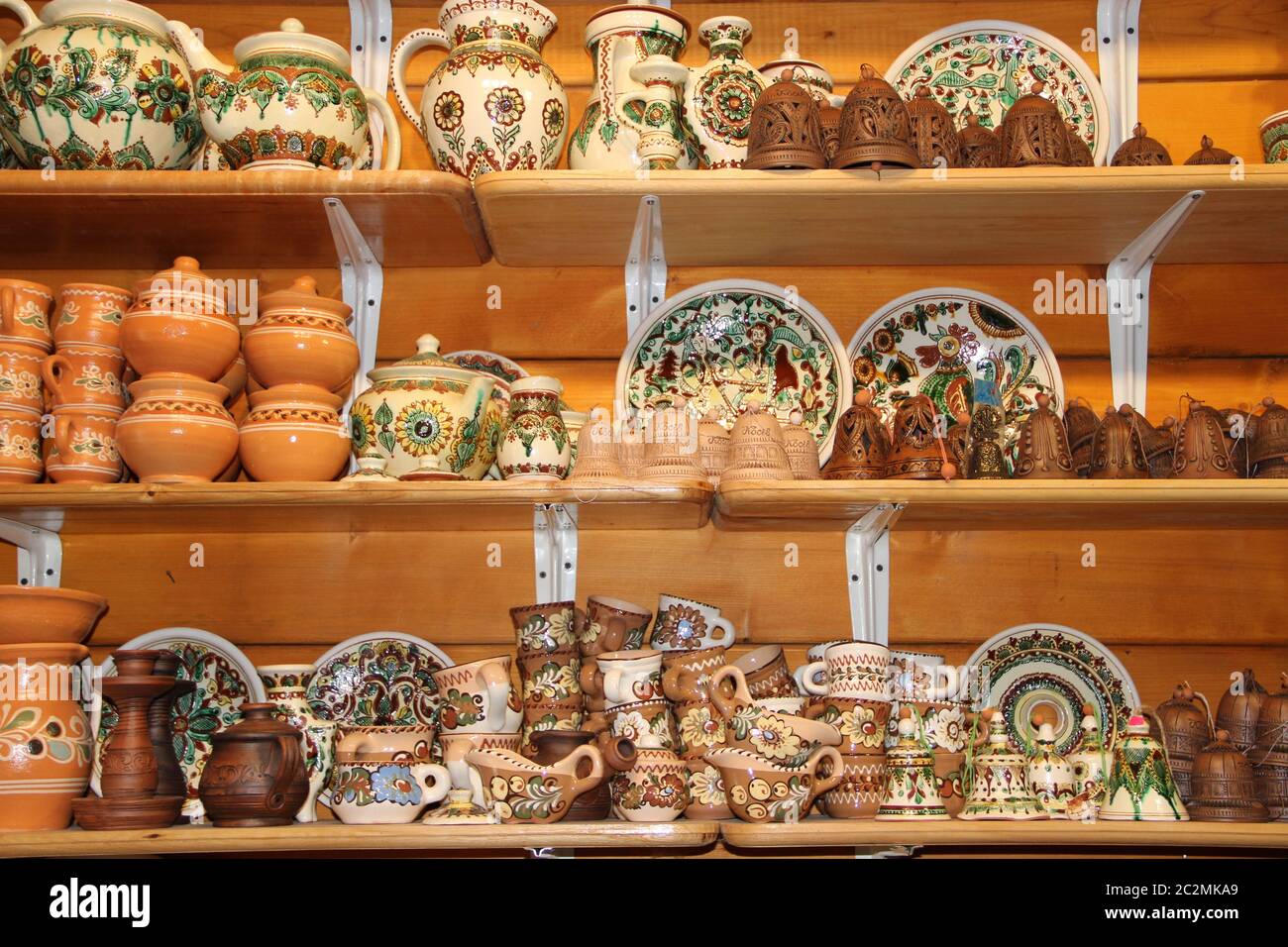 A wide choice of ceramic products on the shelf of the store. Pottery for sale.Ceramic goods Stock Photo
