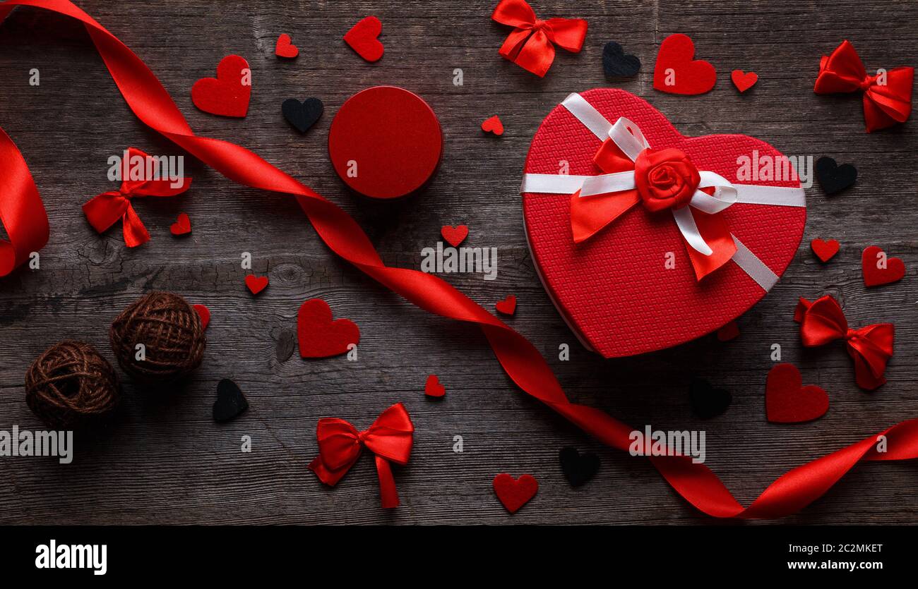 Gifts for Valentines Day. Heart shaped gift boxes and red roses on ...