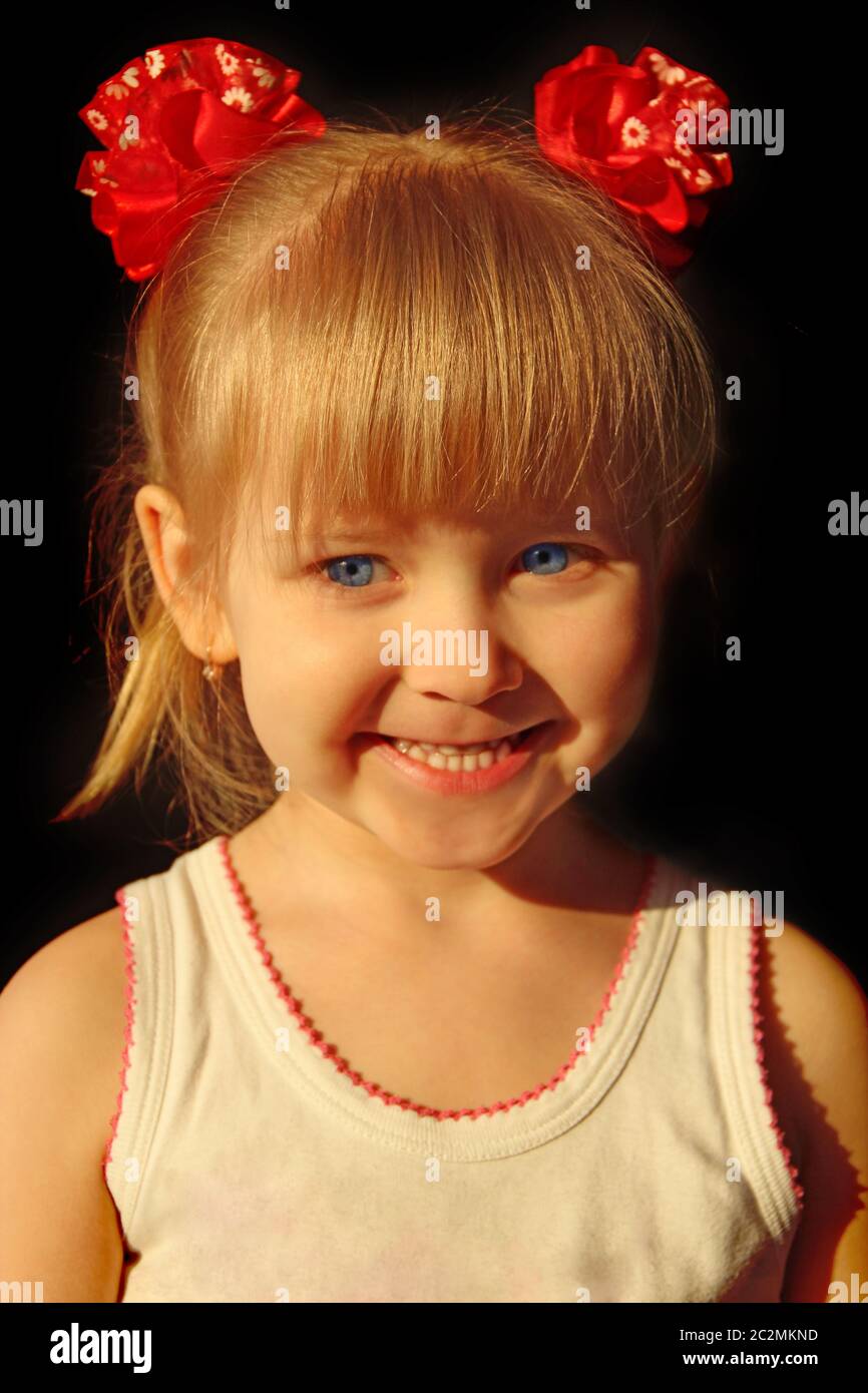 Portrait of smiling baby in amusing red bows. Childhood is the best time. Happy child Stock Photo