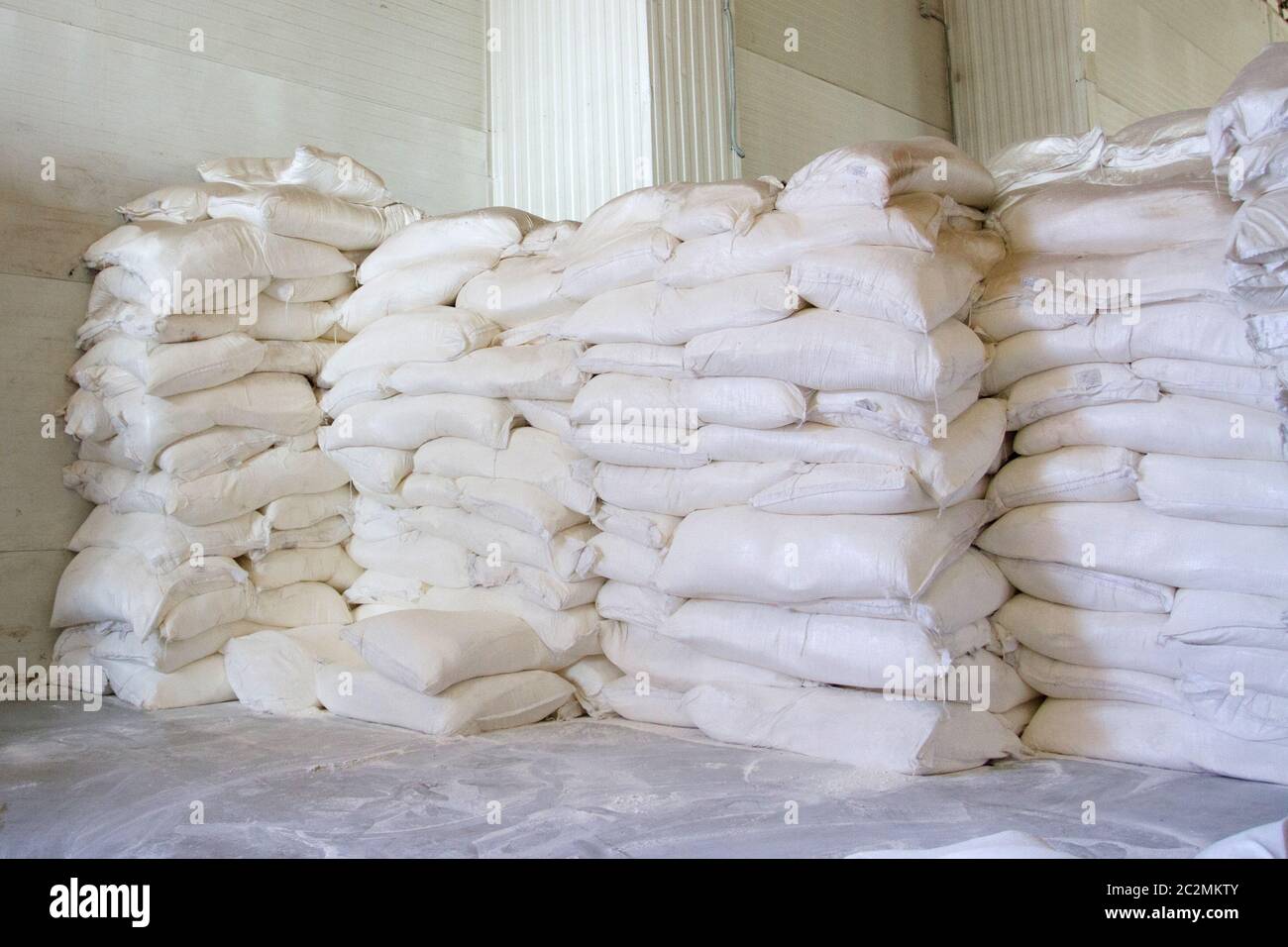 warehouse storage with white flour bags Stock Photo Alamy