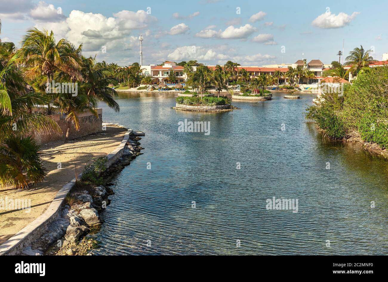 Residential area of Puerto aventuras in mexico, with luxurious private homes overlooking the waterway that leads directly to the sea and the beach. Stock Photo
