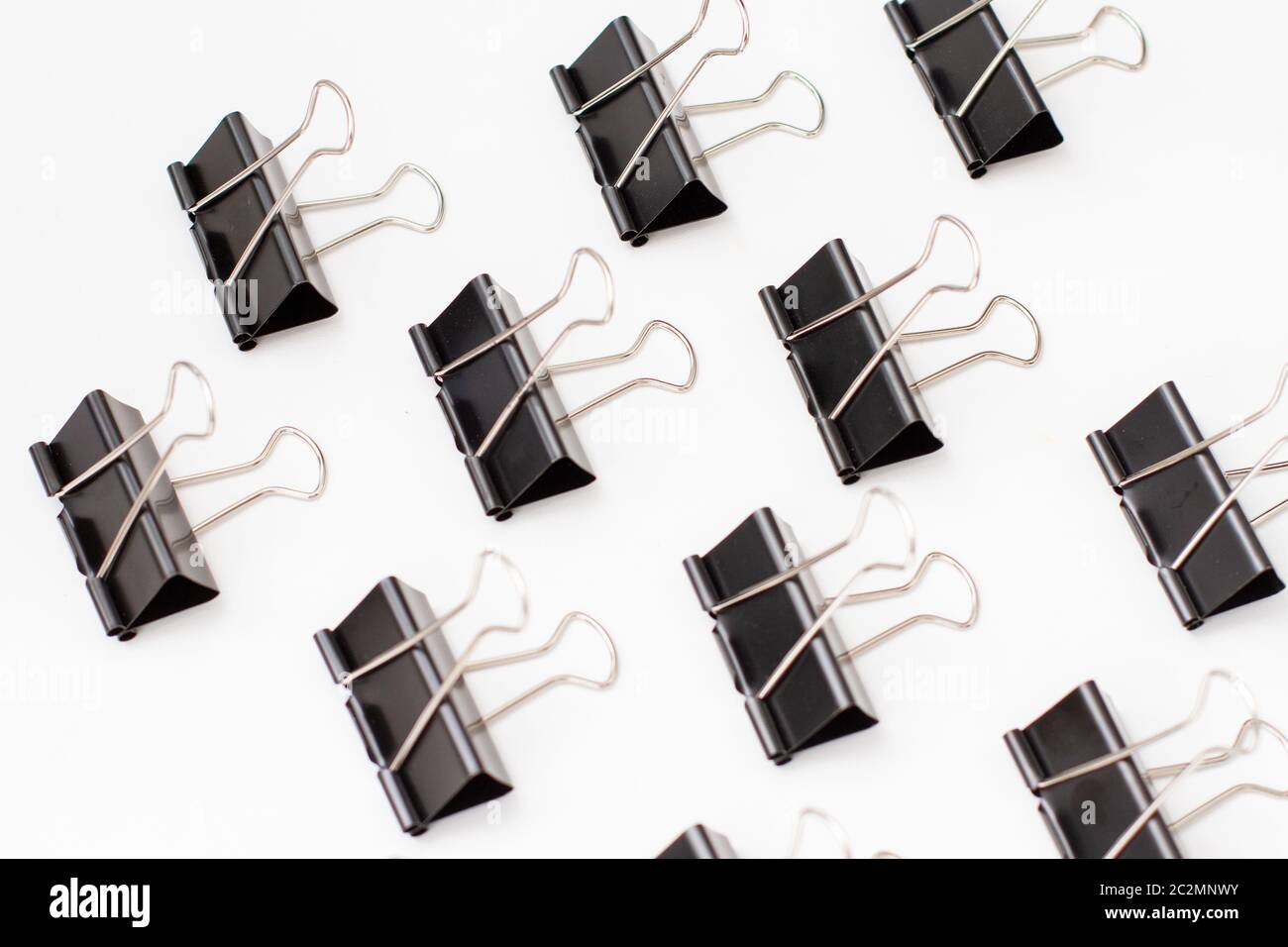 pattern of binder clips isolated on white background Stock Photo - Alamy