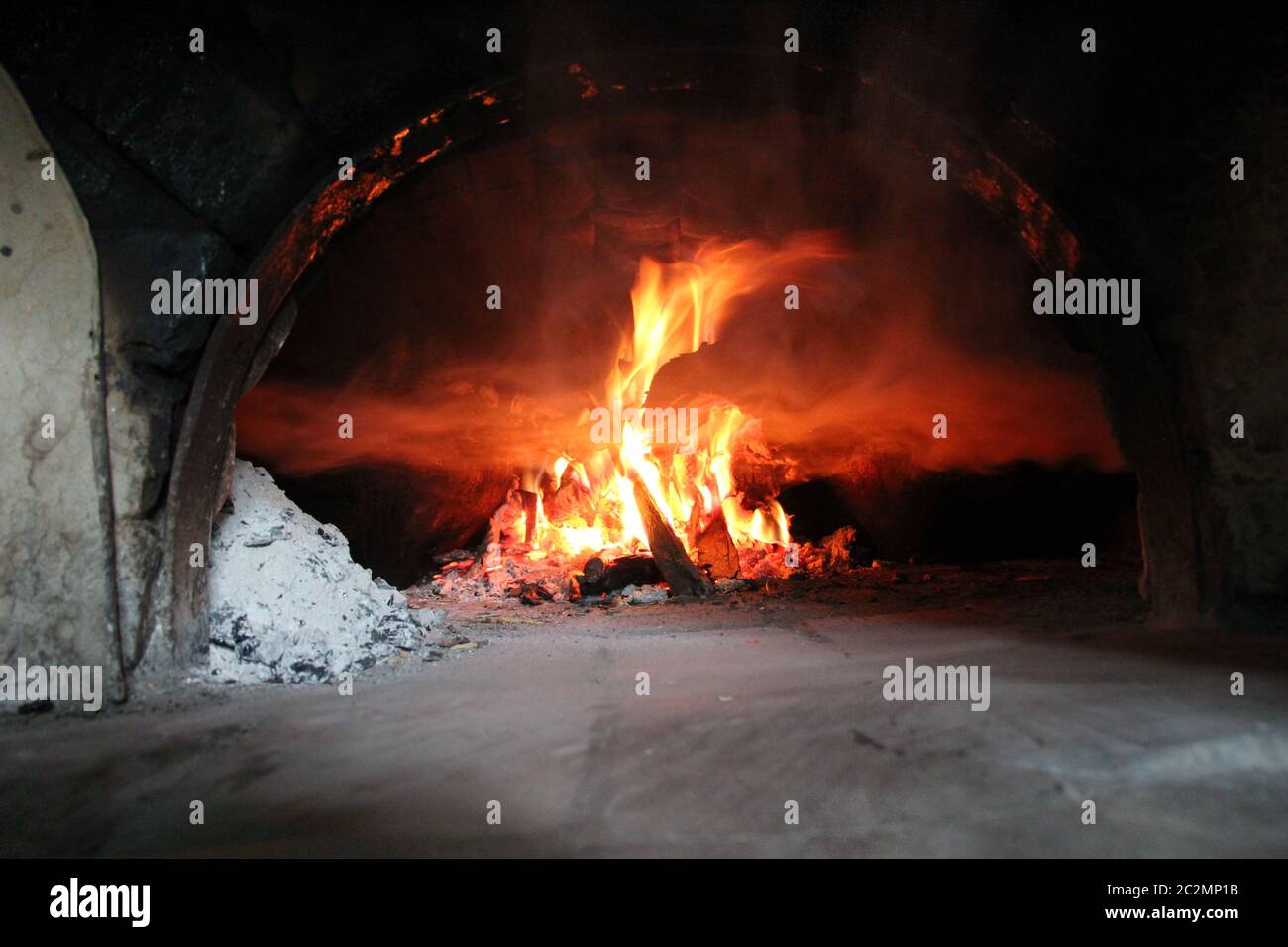 Fire wood brighly burning in furnace. Firewood burn in rural oven