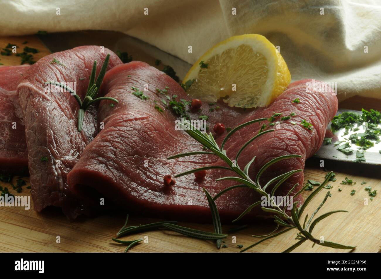 Raw steaks with herbs and spices Stock Photo Alamy