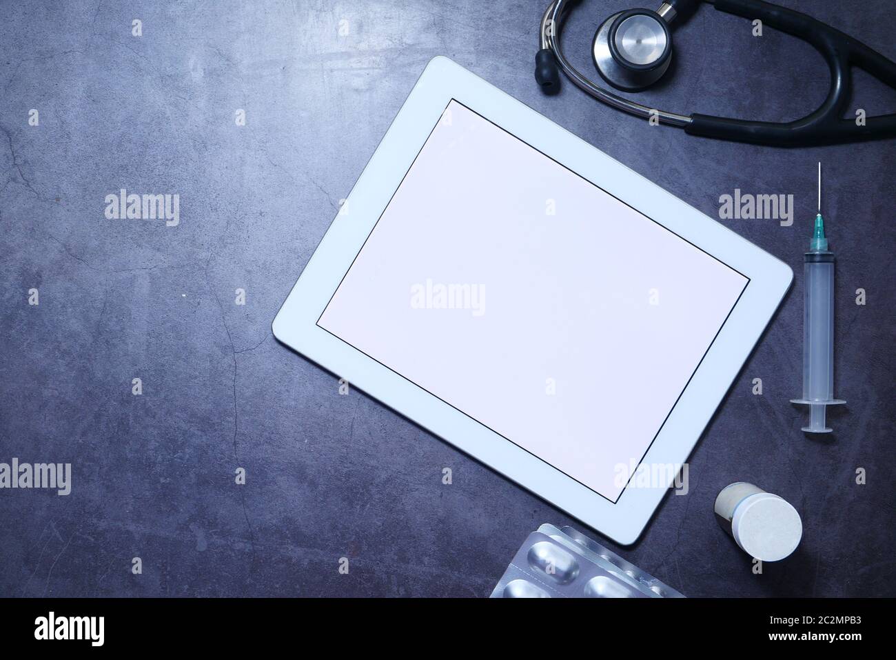 Medical Stethoscope and digital tablet on dark background Stock Photo ...