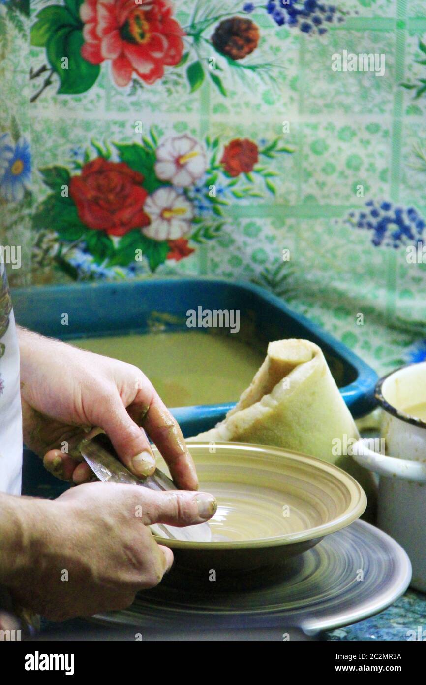 Pottery making process. Ceramic from clay. Potter in work. Art of