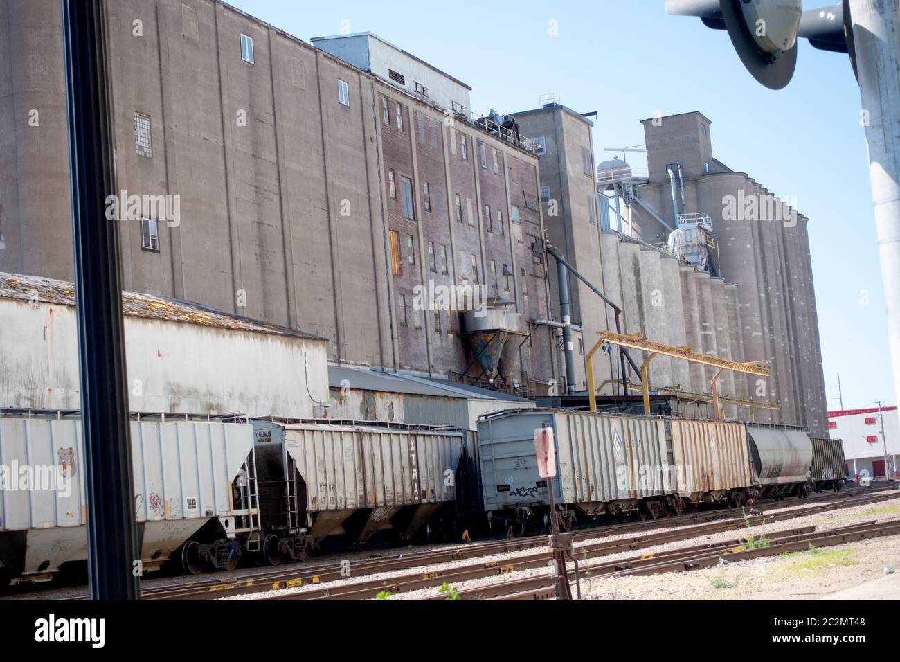 Grain elevators along with the railroad cars waiting to be loaded. Minneapolis Minnesota MN USA Stock Photo