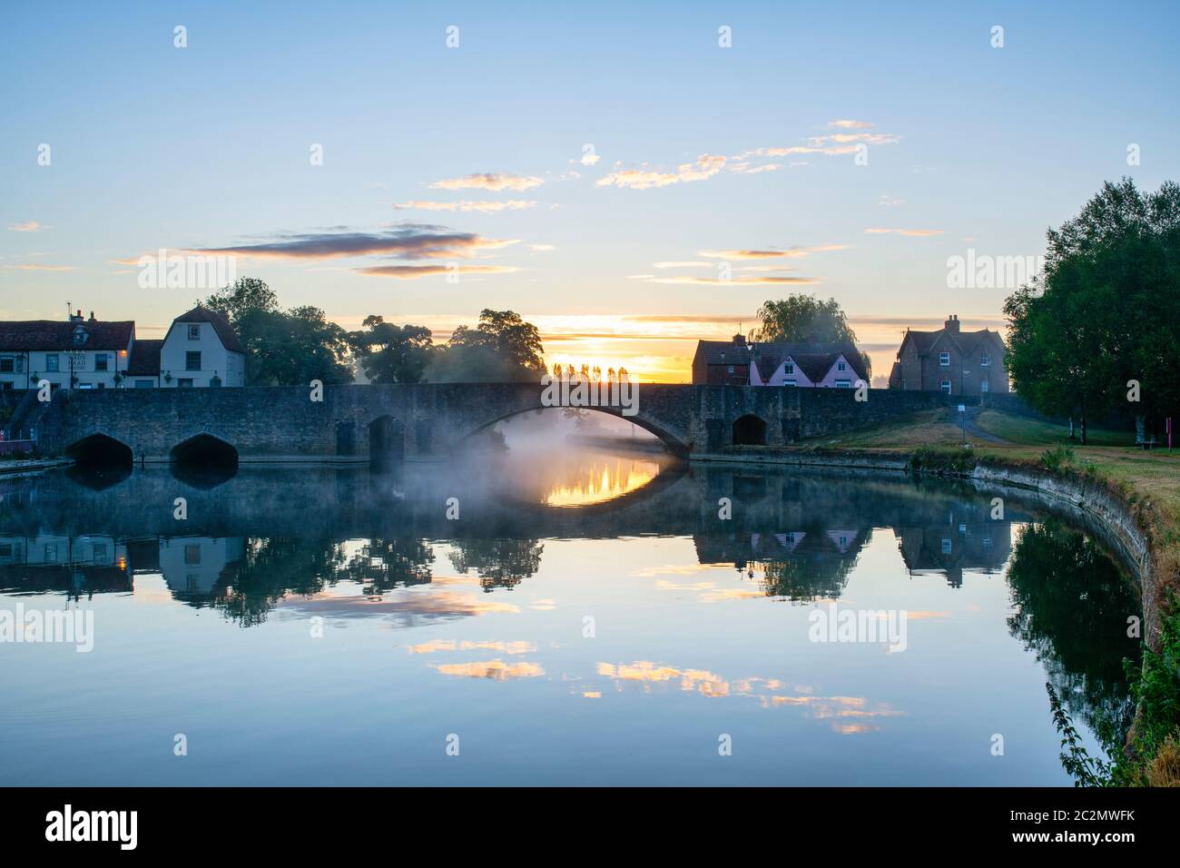 Abingdon bridge with reflection at sunrise. Abingdon on Thames, Oxfordshire, England Stock Photo