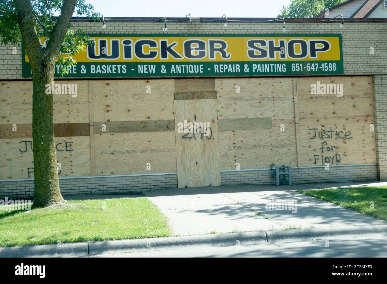 Wicker shop with plywood boarded up windows marked with Justice for Floyd. St Paul Minnesota MN USA Stock Photo