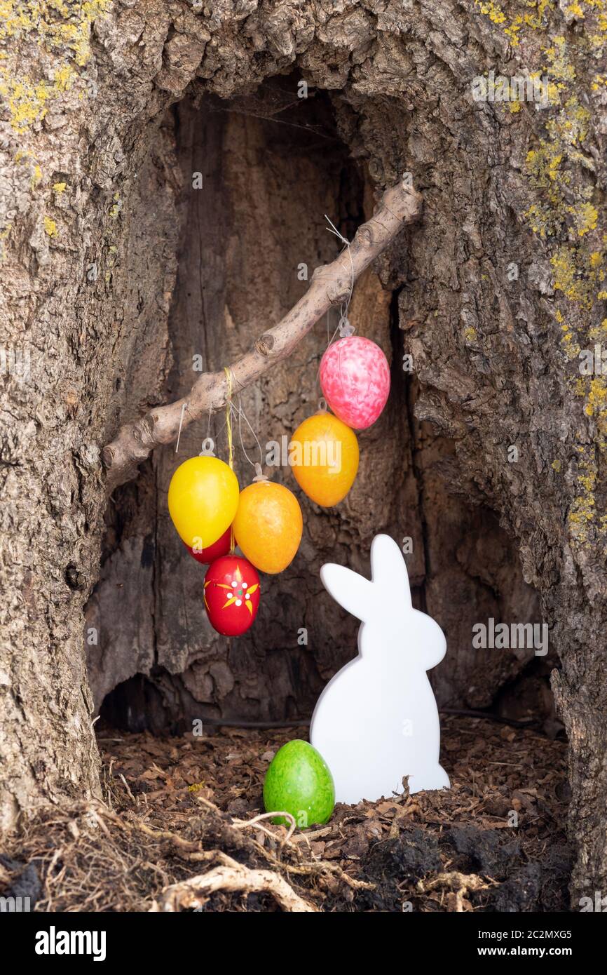 Easter decoration in a tree trunk Stock Photo