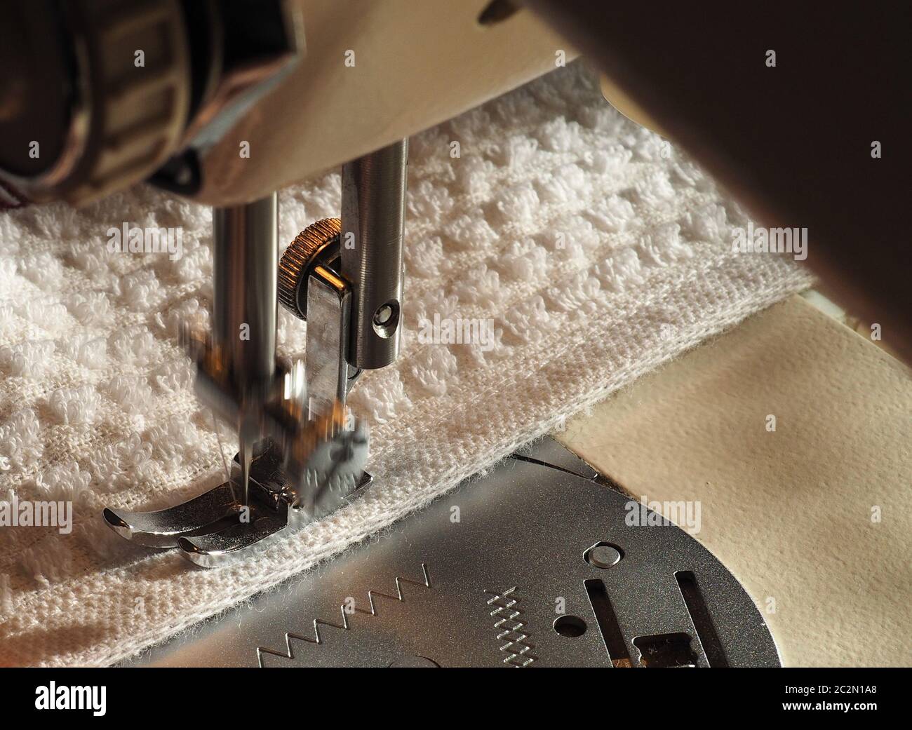 sewing machine to sew pieces of cloth together, motion blur showing