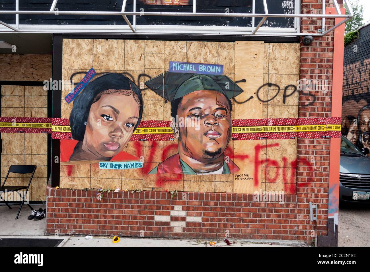 Say their names artistic portraits of Breonna Taylor and Michael Brown on plywood window protectors killed by police . Minneapolis Minnesota MN USA Stock Photo