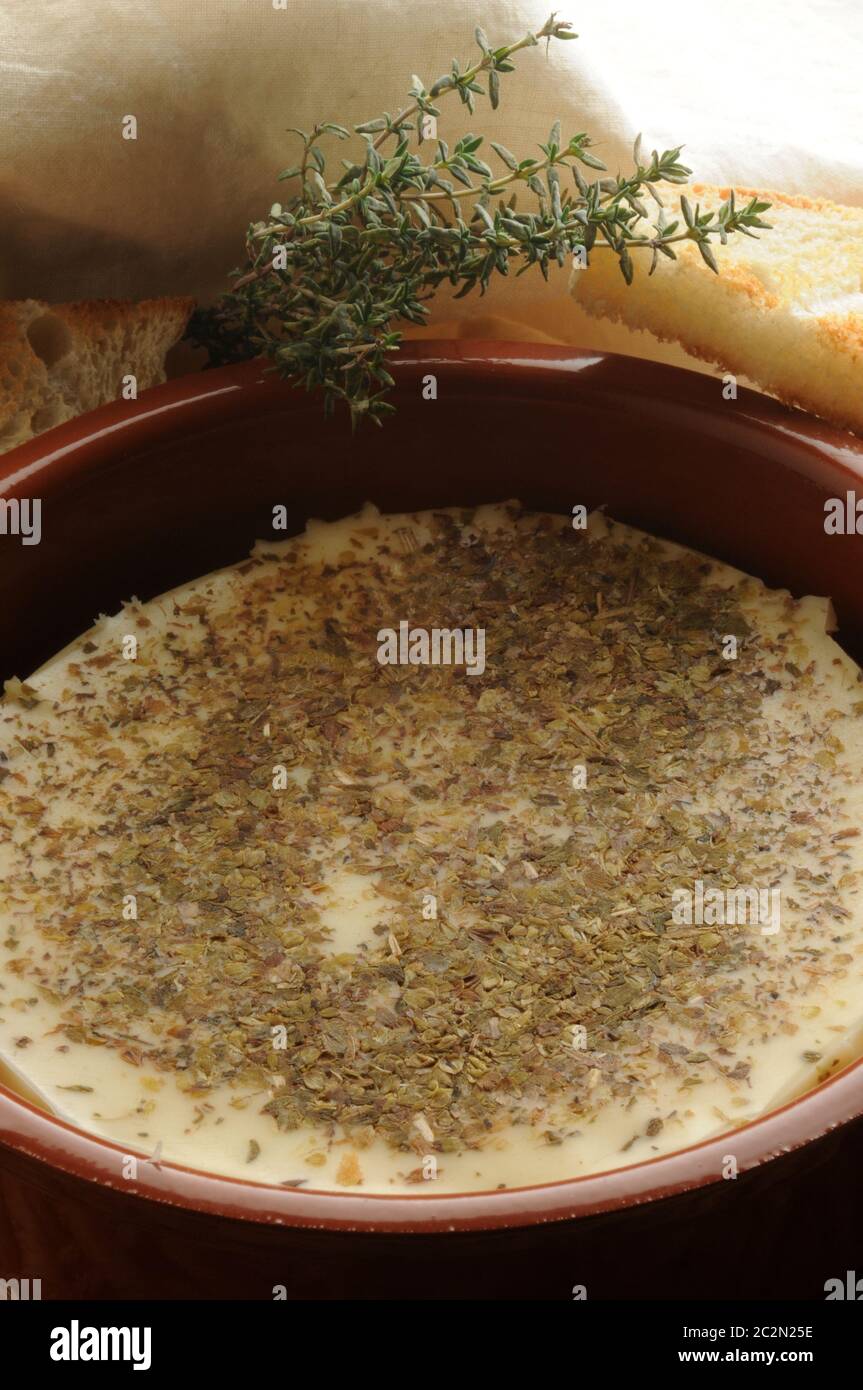 Provolone cheese melted with oregano Stock Photo Alamy