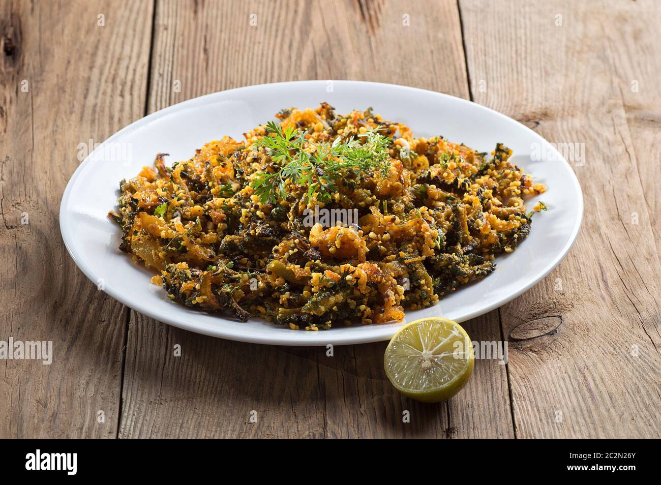 Indian Dish Bitter Gourd Fry With Spices And Herbs Stock Photo Alamy