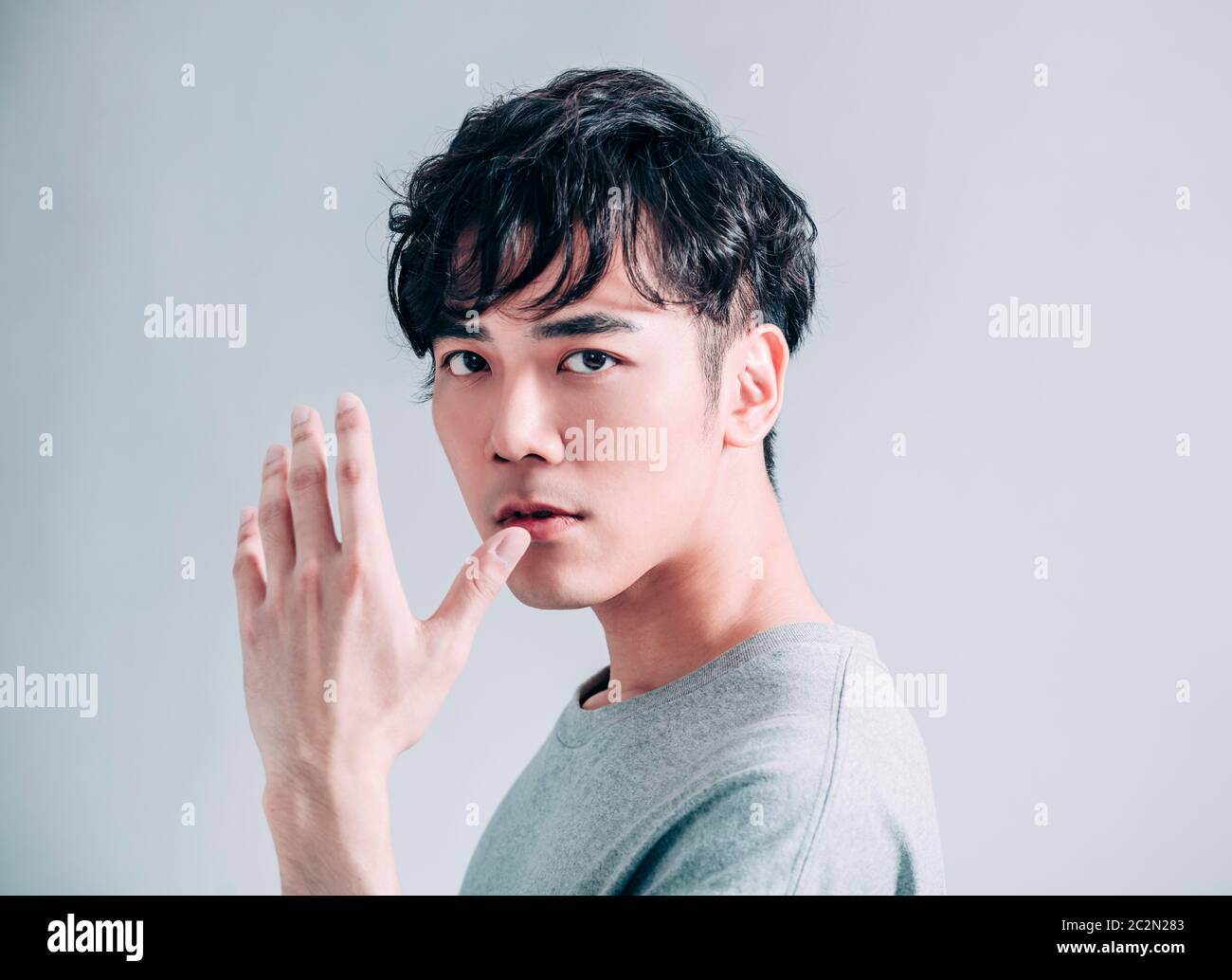 Handsome asian man in gray hi-res stock photography and images - Alamy