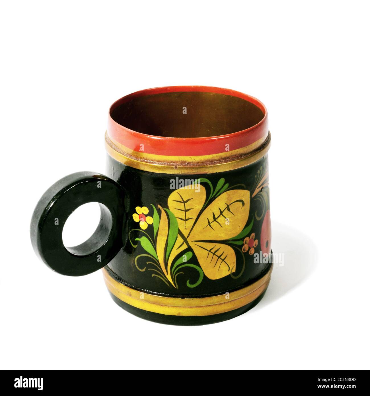 Wooden mug, painted in the style of Khokhloma Stock Photo