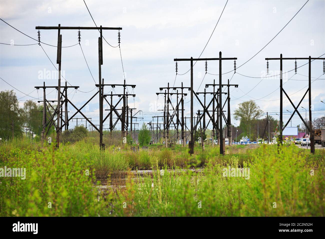 Conglomeration timber supports high-voltage line Stock Photo