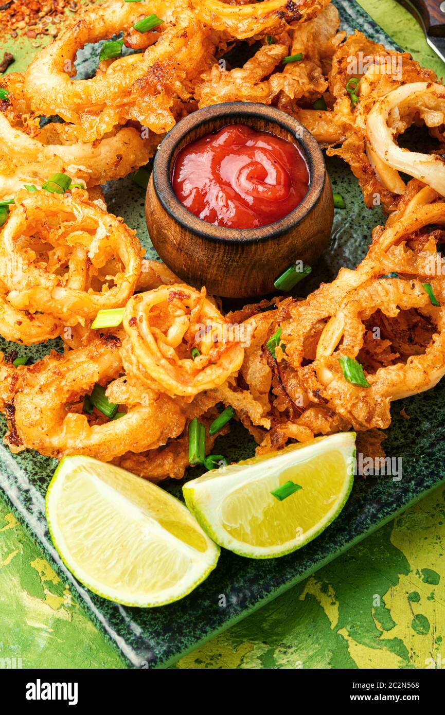 Crunchy deep fried squid rings in batter.Fried squid rings breaded with