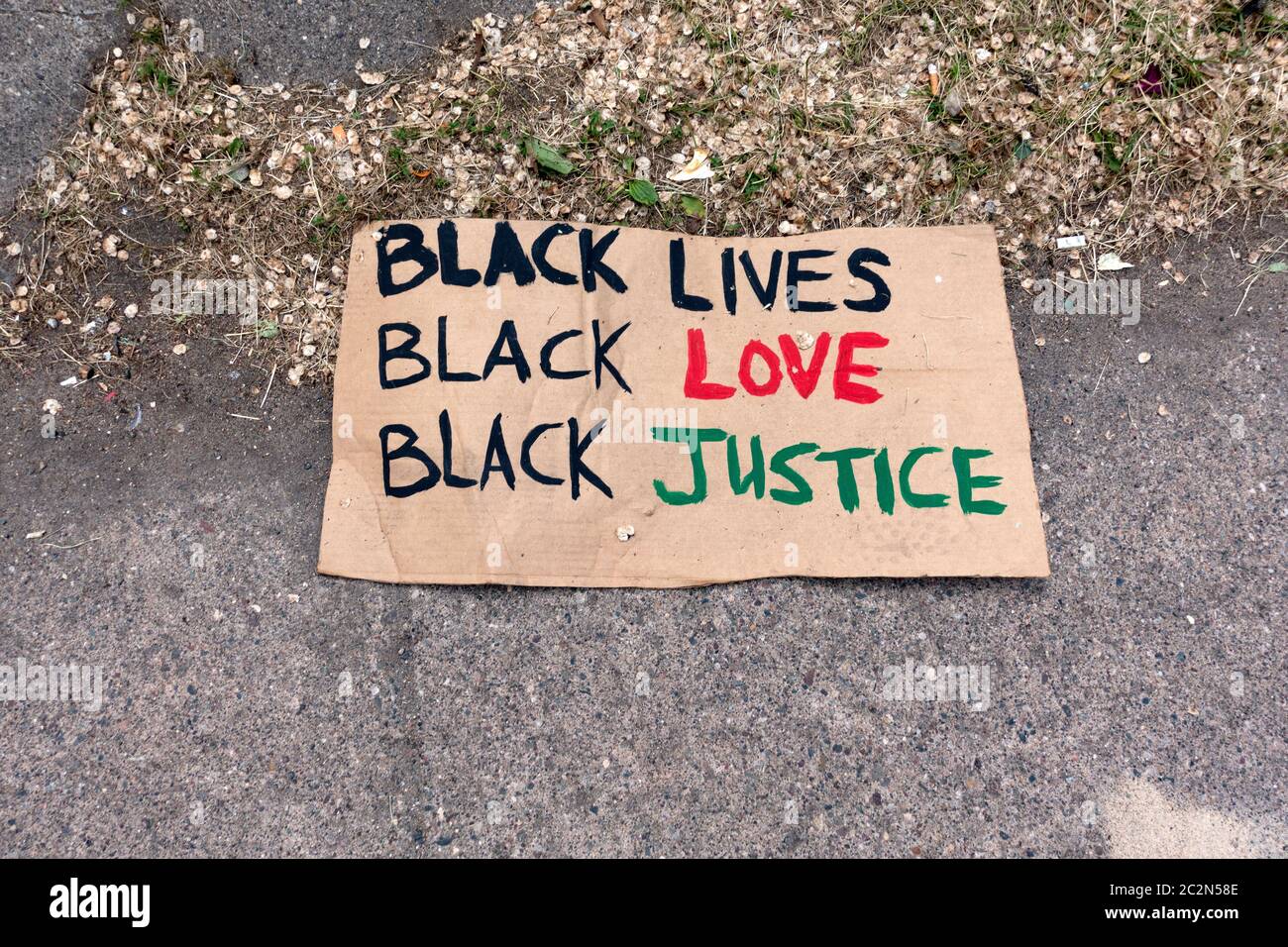 Street poster saying 'Black Lives' Black Love' 'Black Justice' at site of George Floyd death 38th and Chicago. Minneapolis Minnesota MN USA Stock Photo