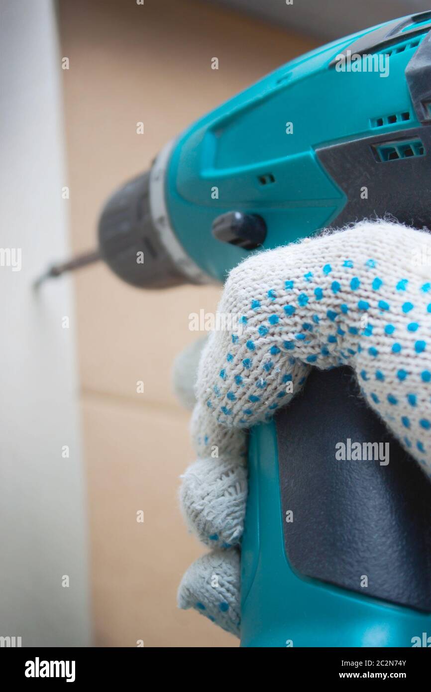 Screwdriver in the hand Stock Photo